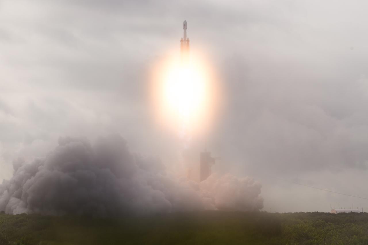 A SpaceX Falcon Heavy rocket with the Psyche spacecraft onboard is launched from Launch Complex 39A, Friday, Oct. 13, 2023, at NASA’s Kennedy Space Center in Florida. NASA’s Psyche spacecraft will travel to a metal-rich asteroid by the same name orbiting the Sun between Mars and Jupiter to study it’s composition. The spacecraft also carries the agency's Deep Space Optical Communications technology demonstration, which will test laser communications beyond the Moon. Photo Credit: (NASA/Aubrey Gemignani)