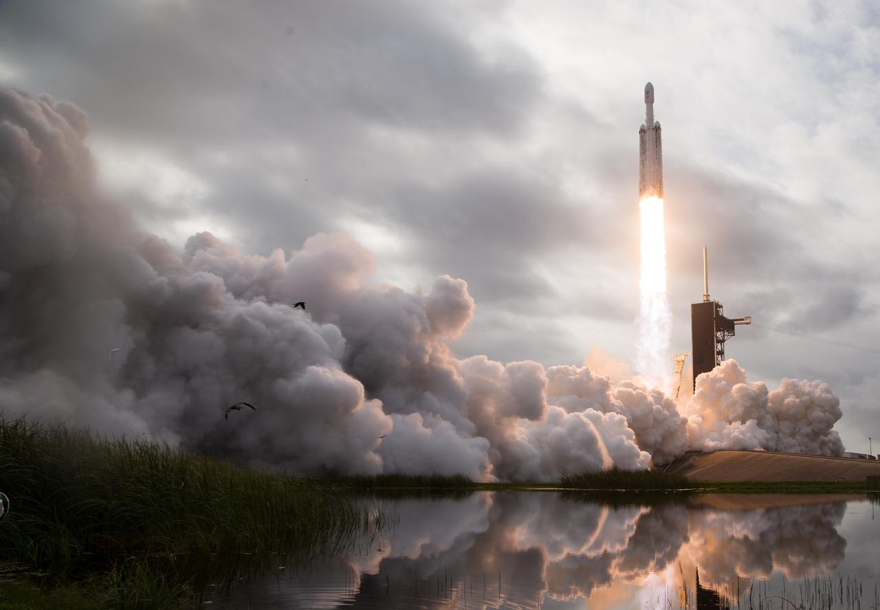 A SpaceX Falcon Heavy rocket with the Psyche spacecraft onboard is launched from Launch Complex 39A, Friday, Oct. 13, 2023, at NASA’s Kennedy Space Center in Florida. NASA’s Psyche spacecraft will travel to a metal-rich asteroid by the same name orbiting the Sun between Mars and Jupiter to study it’s composition. The spacecraft also carries the agency's Deep Space Optical Communications technology demonstration, which will test laser communications beyond the Moon. Photo Credit: (NASA/Aubrey Gemignani)