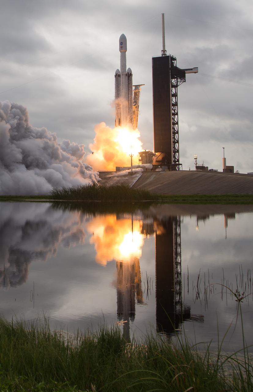 A SpaceX Falcon Heavy rocket with the Psyche spacecraft onboard is launched from Launch Complex 39A, Friday, Oct. 13, 2023, at NASA’s Kennedy Space Center in Florida. NASA’s Psyche spacecraft will travel to a metal-rich asteroid by the same name orbiting the Sun between Mars and Jupiter to study it’s composition. The spacecraft also carries the agency's Deep Space Optical Communications technology demonstration, which will test laser communications beyond the Moon. Photo Credit: (NASA/Aubrey Gemignani)