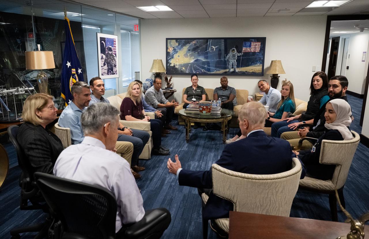 NASA Deputy Administrator Pam Melroy, left, Bob Cabana, NASA associate administrator, and NASA Administrator Bill Nelson, speak with the 2021 astronaut candidate class, Wednesday, Oct. 18, 2023, at the Mary W. Jackson NASA Headquarters building in Washington. Upon completion of two years of training they could be assigned to missions that involve performing research aboard the International Space Station, launching from American soil on spacecraft built by commercial companies, as well as deep space missions to destinations including the Moon on NASA’s Orion spacecraft and Space Launch System rocket. Photo Credit: (NASA/Joel Kowsky)