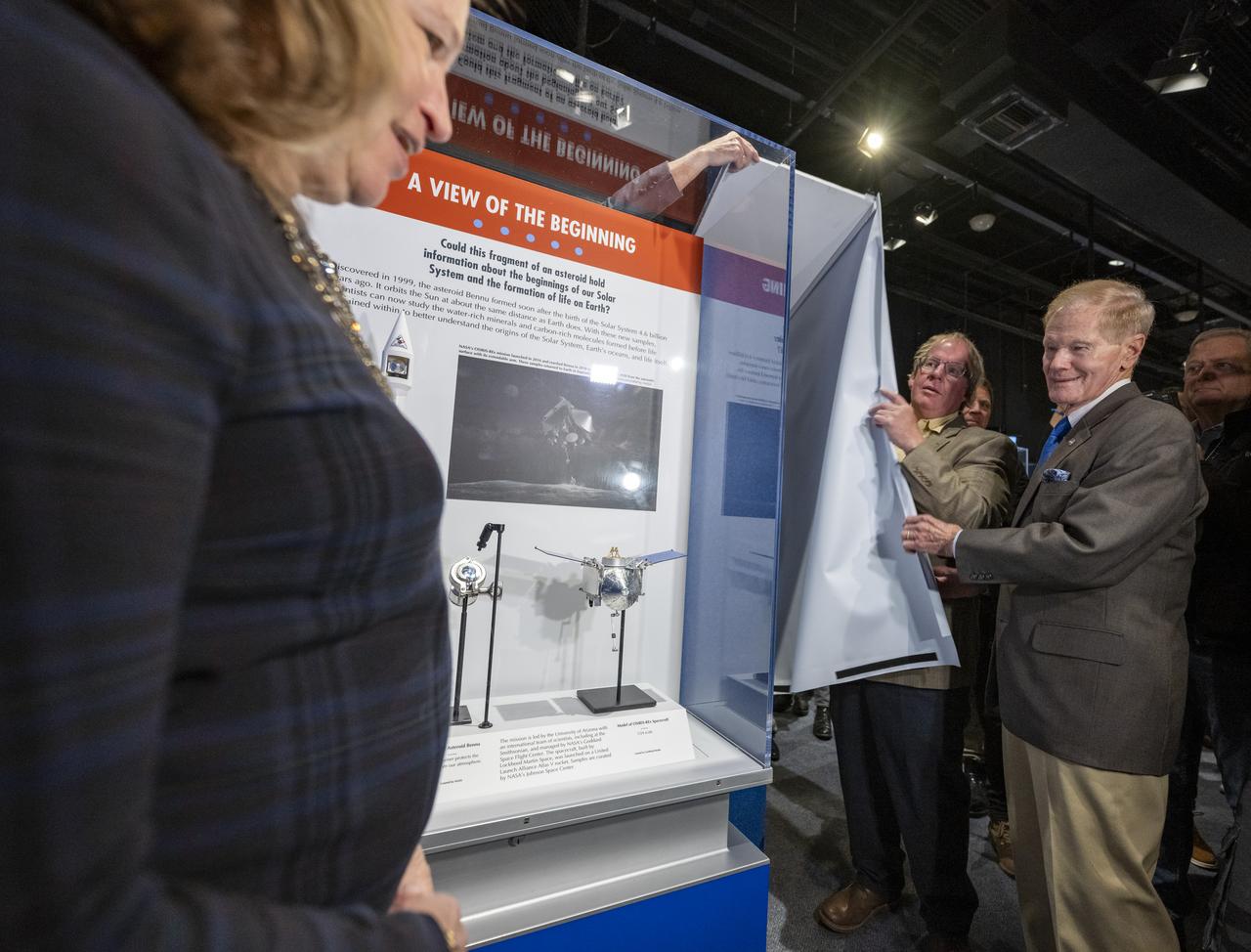 From left to right, Smithsonian Under Secretary for Science and Research Ellen Stofan, National Museum of Natural History curator of meteorites Tim McCoy, and NASA Administrator Bill Nelson unveil the first public display of a sample from asteroid Bennu, Friday, Nov. 3, 2023, at the Smithsonian’s National Museum of Natural History in Washington. The sample was collected from the carbon rich near Earth asteroid Bennu in October 2020 by NASA’s OSIRIS-REx spacecraft. Photo Credit: (NASA/Keegan Barber)