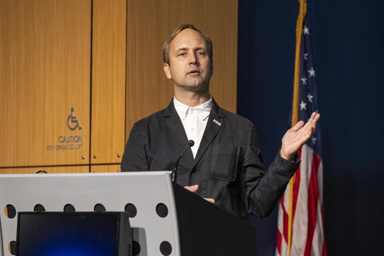 NASA Creative Art Director David Rager delivers remarks during a dedication event for Richard Danne, creator of the NASA worm logotype, Monday, Nov. 6, 2023, at the Mary W. Jackson NASA Headquarters building in Washington. Photo Credit: (NASA/Keegan Barber)