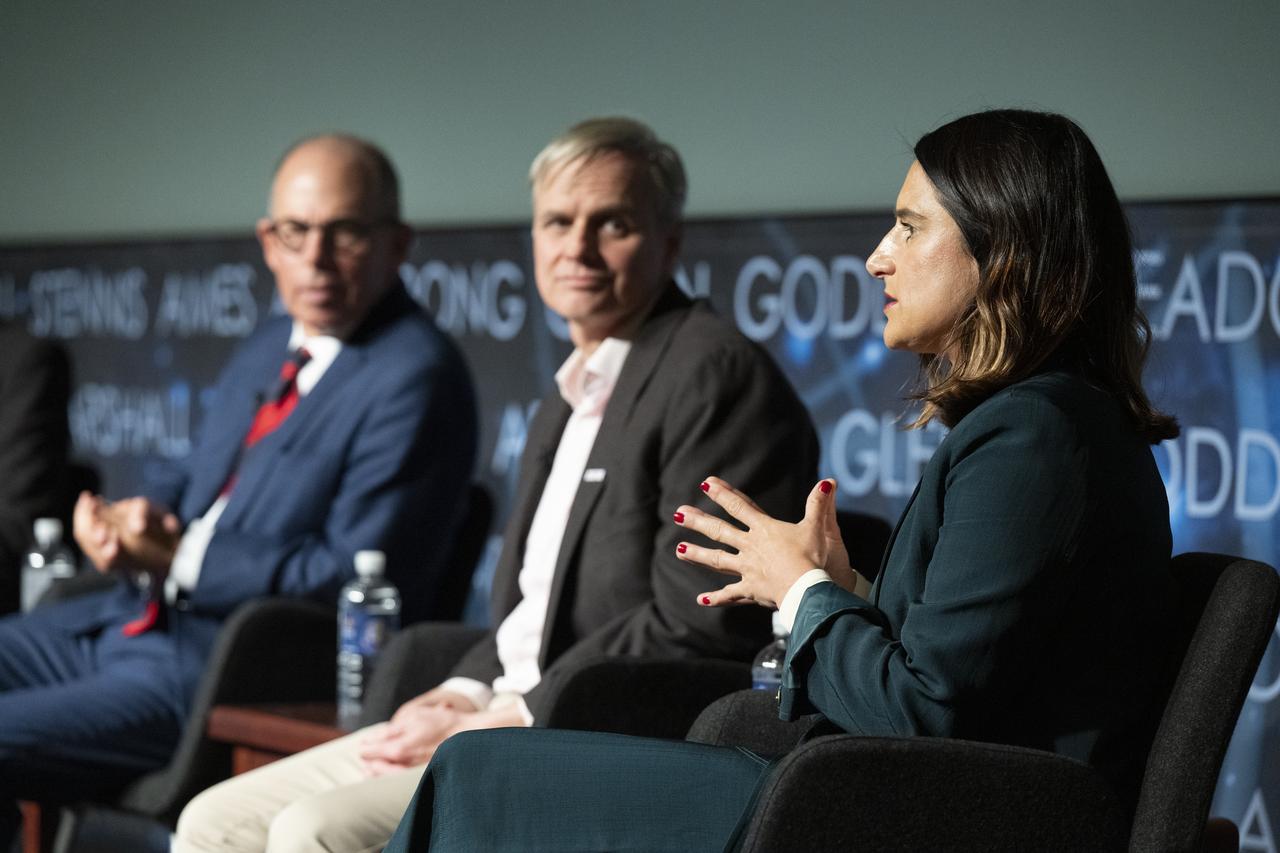 From left to right, Pentagram designer Michael Bierut, NASA entertainment and branding liaison Bert Ulrich, and Amazon Music head of live event merchandise Julia Heiser, participate in a panel discussion during a Richard Danne dedication event, Monday, Nov. 6, 2023, at the Mary W. Jackson NASA Headquarters building in Washington.  Photo Credit: (NASA/Keegan Barber)