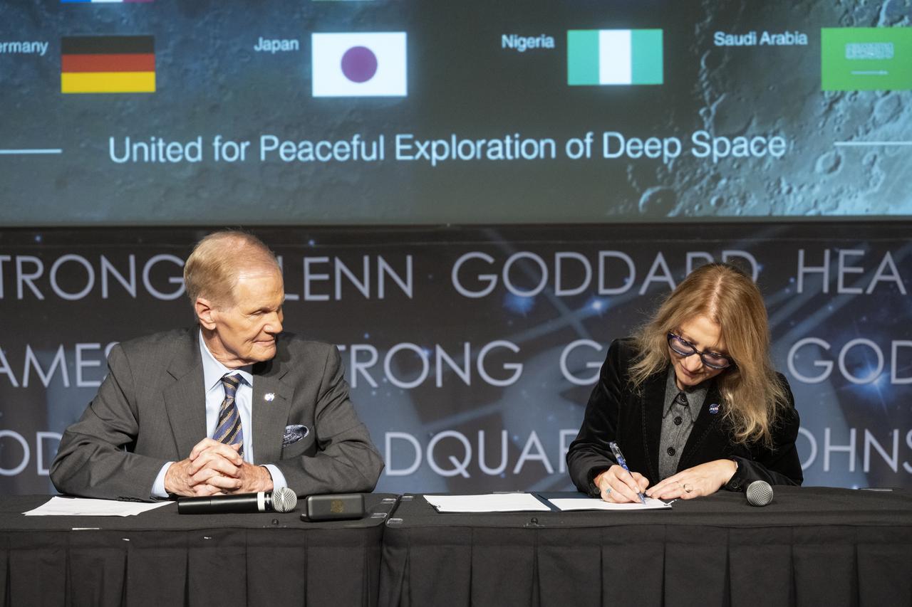 Minister of Innovation and Growth for Bulgaria Milena Stoycheva, right, signs the Artemis Accords as NASA Administrator Bill Nelson looks on Thursday, Nov. 9, 2023, at the Mary W. Jackson NASA Headquarters building in Washington. Bulgaria is the 32nd country to sign the Artemis Accords, which establish a practical set of principles to guide space exploration cooperation among nations participating in NASA’s Artemis program. Photo Credit: (NASA/Keegan Barber)