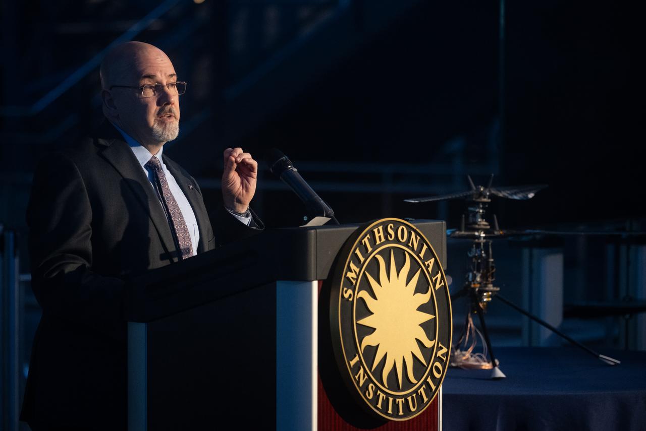 Eric Ianson, deputy director of the Planetary Science Division and director of the Mars Exploration Program and Radioisotope Power Systems Program at NASA speaks at an event marking NASA’s donation of the aerial prototype of the Ingenuity Mars Helicopter, Friday, Dec. 15, 2023, at the Smithsonian National Air and Space Museum’s Steve F. Udvar-Hazy Center in Chantilly, Va. The aerial prototype of the Ingenuity Mars Helicopter, which was the first to demonstrate it was possible to fly in a simulated Mars environment at NASA’s Jet Propulsion Laboratory (JPL), was donated to the museum on Friday.  Photo Credit: (NASA/Joel Kowsky)