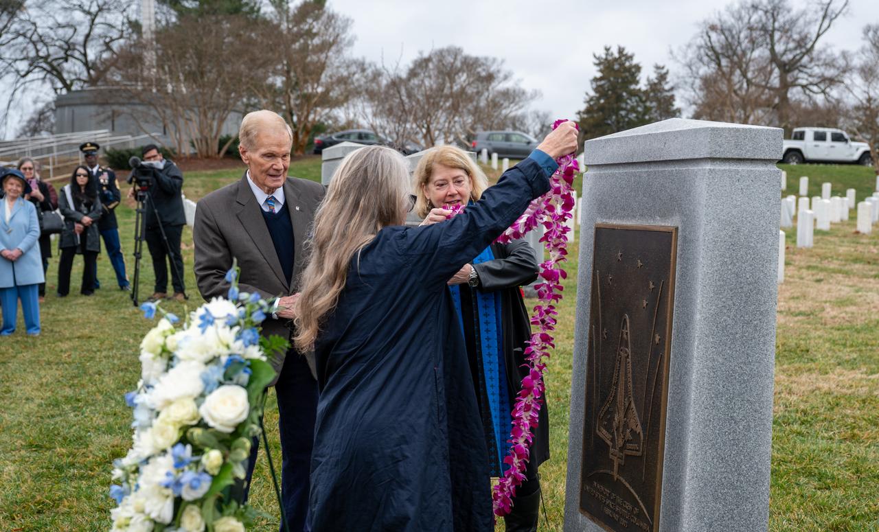 NASA Administrator Bill Nelson, NASA Deputy Administrator Pam Melroy, and Columbia astronaut William McCool’s family friend Kristy Carroll help place a lei at the Space Shuttle Columbia Memorial during a wreath laying ceremony that was part of NASA's Day of Remembrance, Thursday, Jan. 25, 2024, at Arlington National Cemetery in Arlington, Va. The wreaths were laid in memory of those men and women who lost their lives in the quest for space exploration. Photo Credit: (NASA/Keegan Barber)