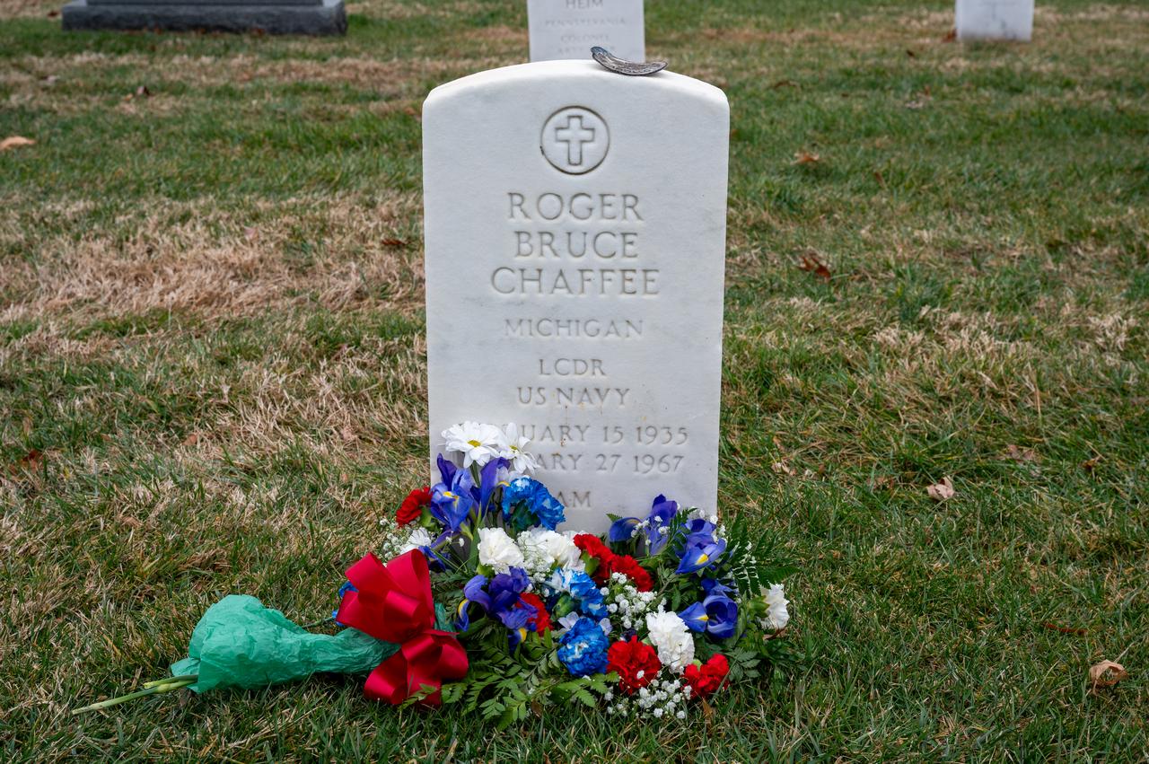 Flowers are seen at the grave marker of Roger Chaffee from Apollo 1 after NASA Administrator Bill Nelson and Deputy Administrator Pam Melroy placed them there during a ceremony that was part of NASA's Day of Remembrance, Thursday, Jan. 25, 2024, at Arlington National Cemetery in Arlington, Va. The wreaths were laid in memory of those men and women who lost their lives in the quest for space exploration. Photo Credit: (NASA/Keegan Barber)