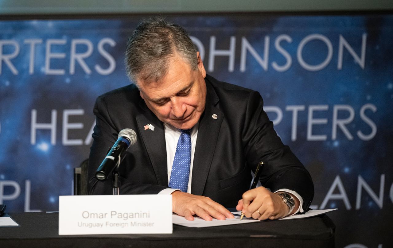 Uruguayan Foreign Minister Omar Pagani signs the Artemis Accords, Thursday, Feb. 15, 2024, at the Mary W. Jackson NASA Headquarters building in Washington. Uruguay is the 36th country to sign the Artemis Accords, which establish a practical set of principles to guide space exploration cooperation among nations participating in NASA’s Artemis program. Photo Credit: (NASA/Keegan Barber)