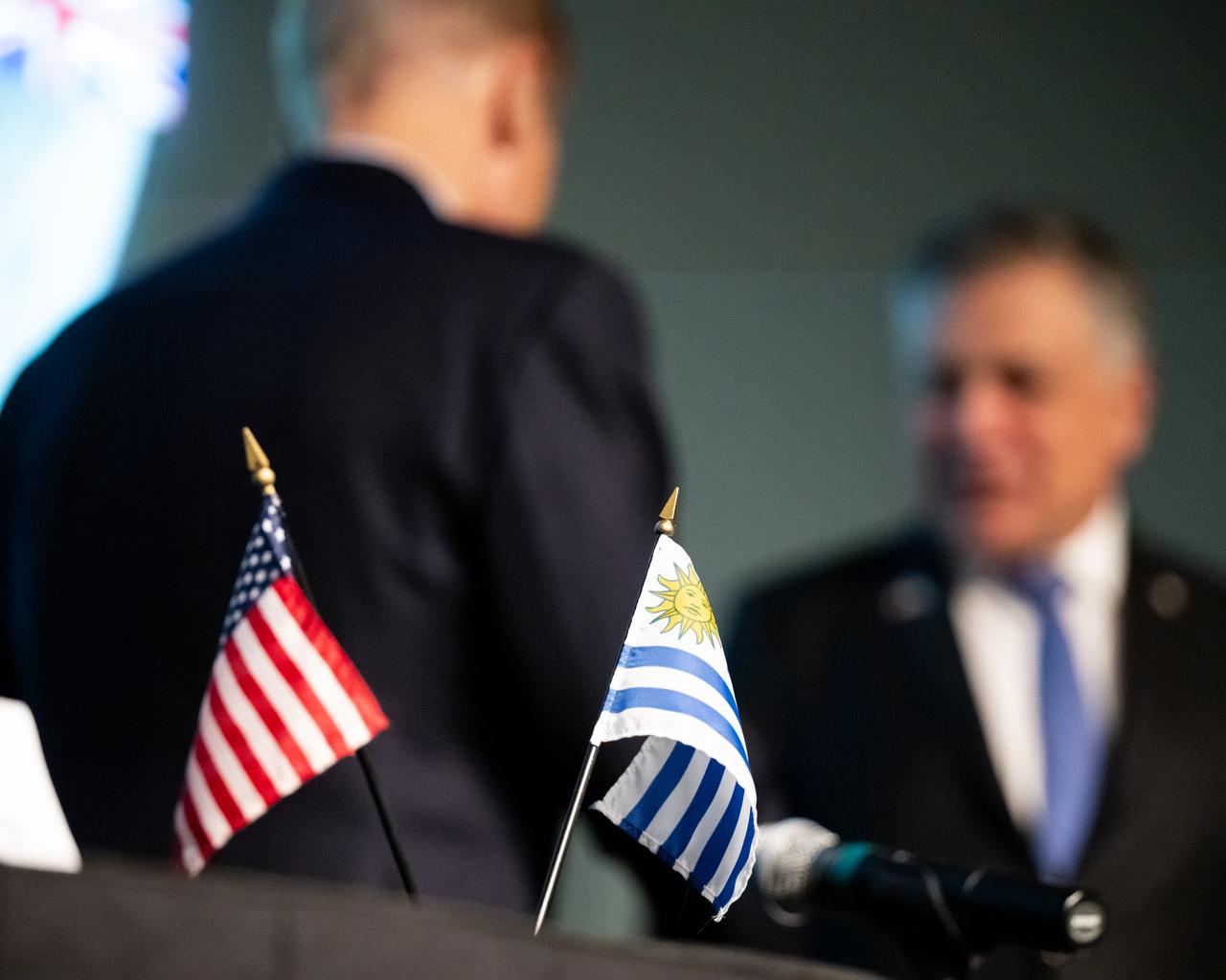The flags of the United States and Uruguay are seen during an Artemis Accords signing ceremony, Thursday, Feb. 15, 2024, at the Mary W. Jackson NASA Headquarters building in Washington. Uruguay is the 36th country to sign the Artemis Accords, which establish a practical set of principles to guide space exploration cooperation among nations participating in NASA’s Artemis program. Photo Credit: (NASA/Keegan Barber)