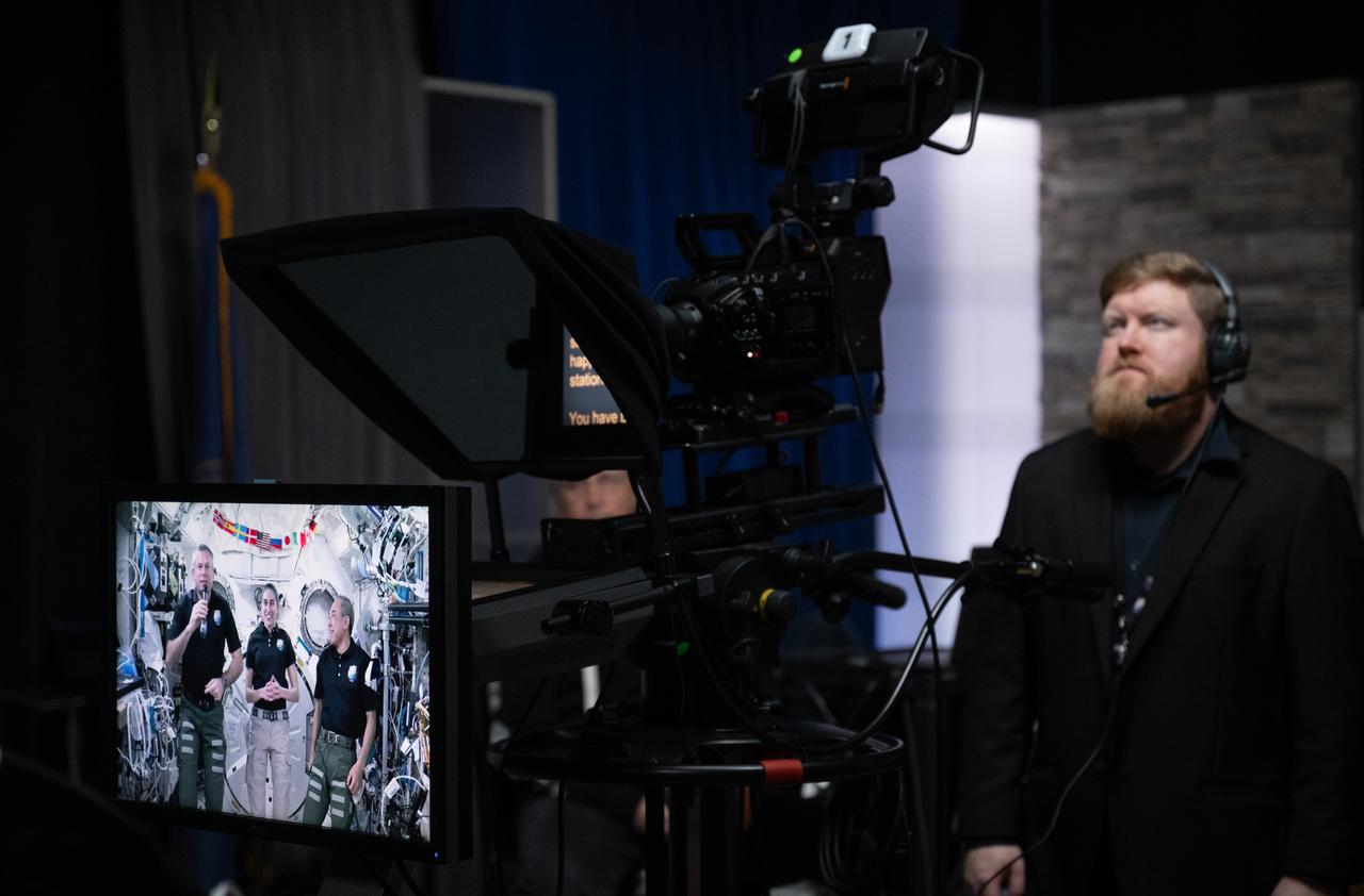 Expedition 70 crew members Andreas Mogenson of ESA left, Jasmin Moghbeli of NASA, and Satoshi Furukawa of JAXA are seen aboard the International Space Station on a monitor as they talk with NASA Administrator Bill Nelson and Lisa Carnell, director of NASA’s Biological and Physical Sciences Division, during an Earth-to-space call, Wednesday, Feb. 21, 2024, at the Mary W. Jackson NASA Headquarters building in Washington. Nelson and Carnell spoke with Mogenson, Moghbeli, and Furukawa about recent science research and technology demonstrations aboard the orbiting laboratory. Photo Credit: (NASA/Joel Kowsky)