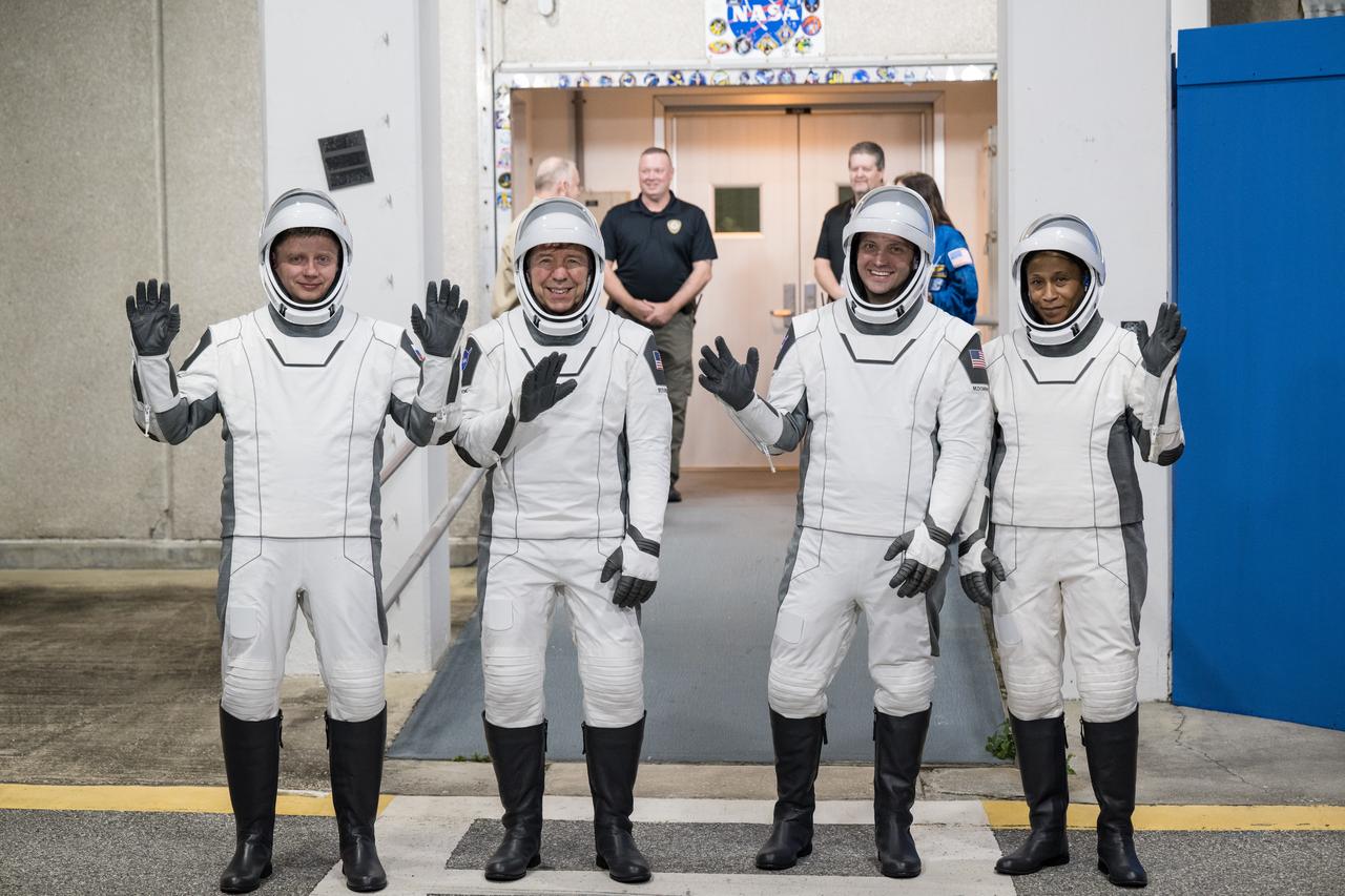 From left to right, Roscosmos cosmonaut Alexander Grebenkin, and NASA astronauts Michael Barratt, Matthew Dominick, and Jeanette Epps, wearing SpaceX spacesuits, are seen as they prepare to depart the Neil A. Armstrong Operations and Checkout Building for Launch Complex 39A during a dress rehearsal prior to the Crew-8 mission launch, Monday, Feb. 26, 2024, at NASA’s Kennedy Space Center in Florida. NASA’s SpaceX Crew-8 mission is the eighth crew rotation mission of the SpaceX Dragon spacecraft and Falcon 9 rocket to the International Space Station as part of the agency’s Commercial Crew Program. Dominick, Barratt, Epps, and Grebenkin are scheduled to launch at 12:04 a.m. EST on Friday, March 1, from Launch Complex 39A at the Kennedy Space Center. Photo Credit: (NASA/Aubrey Gemignani)