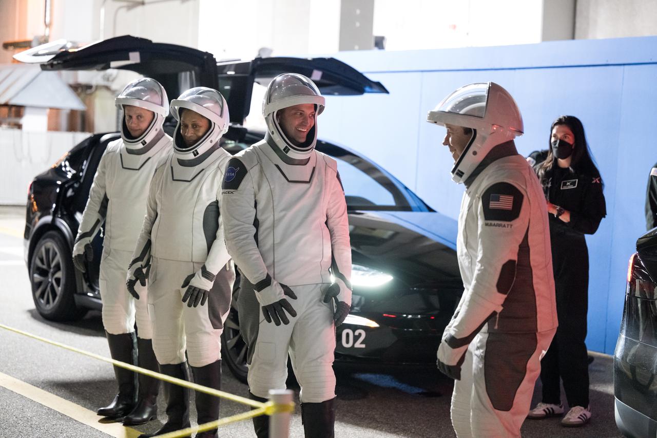 Roscosmos cosmonaut Alexander Grebenkin, and NASA astronauts Jeanette Epps, Matthew Dominick, and Michael Barratt, wearing SpaceX spacesuits, are seen as they prepare to depart the Neil A. Armstrong Operations and Checkout Building for Launch Complex 39A during a dress rehearsal prior to the Crew-8 mission launch, Monday, Feb. 26, 2024, at NASA’s Kennedy Space Center in Florida. NASA’s SpaceX Crew-8 mission is the eighth crew rotation mission of the SpaceX Dragon spacecraft and Falcon 9 rocket to the International Space Station as part of the agency’s Commercial Crew Program. Dominick, Barratt, Epps, and Grebenkin are scheduled to launch at 12:04 a.m. EST on Friday, March 1, from Launch Complex 39A at the Kennedy Space Center. Photo Credit: (NASA/Aubrey Gemignani)