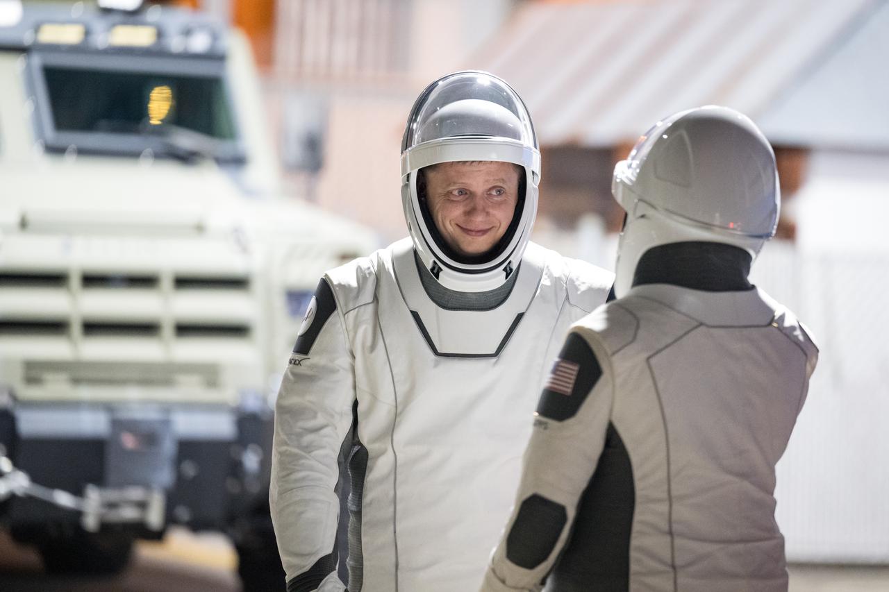 Roscosmos cosmonaut Alexander Grebenkin, and NASA astronaut Jeanette Epps, wearing SpaceX spacesuits, are seen as they prepare to depart the Neil A. Armstrong Operations and Checkout Building for Launch Complex 39A during a dress rehearsal prior to the Crew-8 mission launch, Monday, Feb. 26, 2024, at NASA’s Kennedy Space Center in Florida. NASA’s SpaceX Crew-8 mission is the eighth crew rotation mission of the SpaceX Dragon spacecraft and Falcon 9 rocket to the International Space Station as part of the agency’s Commercial Crew Program. Dominick, Barratt, Epps, and Grebenkin are scheduled to launch at 12:04 a.m. EST on Friday, March 1, from Launch Complex 39A at the Kennedy Space Center. Photo Credit: (NASA/Aubrey Gemignani)