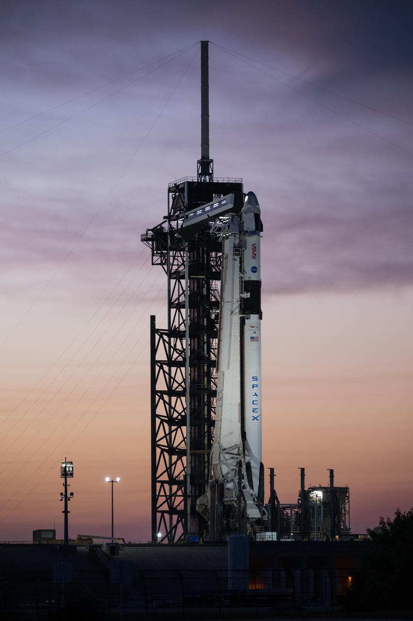 A SpaceX Falcon 9 rocket with the company's Dragon spacecraft on top is seen during sunset on the launch pad at Launch Complex 39A as preparations continue for the Crew-8 mission, Tuesday, Feb. 27, 2024, at NASA’s Kennedy Space Center in Florida. NASA’s SpaceX Crew-8 mission is the eighth crew rotation mission of the SpaceX Crew Dragon spacecraft and Falcon 9 rocket to the International Space Station as part of the agency’s Commercial Crew Program. NASA astronauts Matthew Dominick, Michael Barratt, Jeanette Epps, and Roscosmos cosmonaut Alexander Grebenkin are scheduled to launch at 12:04 a.m. EST on Friday, March 1, from Launch Complex 39A at the Kennedy Space Center. Photo Credit: (NASA/Aubrey Gemignani)