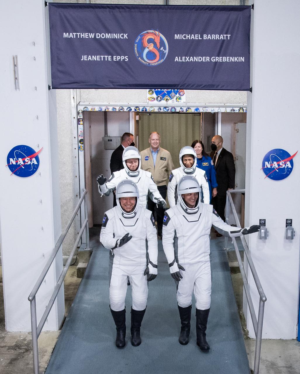 Roscosmos cosmonaut Alexander Grebenkin, back left, NASA astronauts Jeanette Epps, back right, Michael Barratt, left, and Matthew Dominick, right, wearing SpaceX spacesuits, are seen as they prepare to depart the Neil A. Armstrong Operations and Checkout Building for Launch Complex 39A to board the SpaceX Dragon spacecraft for the Crew-8 mission launch, Sunday, March 3, 2024, at NASA’s Kennedy Space Center in Florida. NASA’s SpaceX Crew-8 mission is the eighth crew rotation mission of the SpaceX Crew Dragon spacecraft and Falcon 9 rocket to the International Space Station as part of the agency’s Commercial Crew Program. Dominick, Barratt, Epps, and Grebenkin are scheduled to launch at 10:53 p.m. EST on Sunday, March 3, from Launch Complex 39A at the Kennedy Space Center. Photo Credit: (NASA/Aubrey Gemignani)