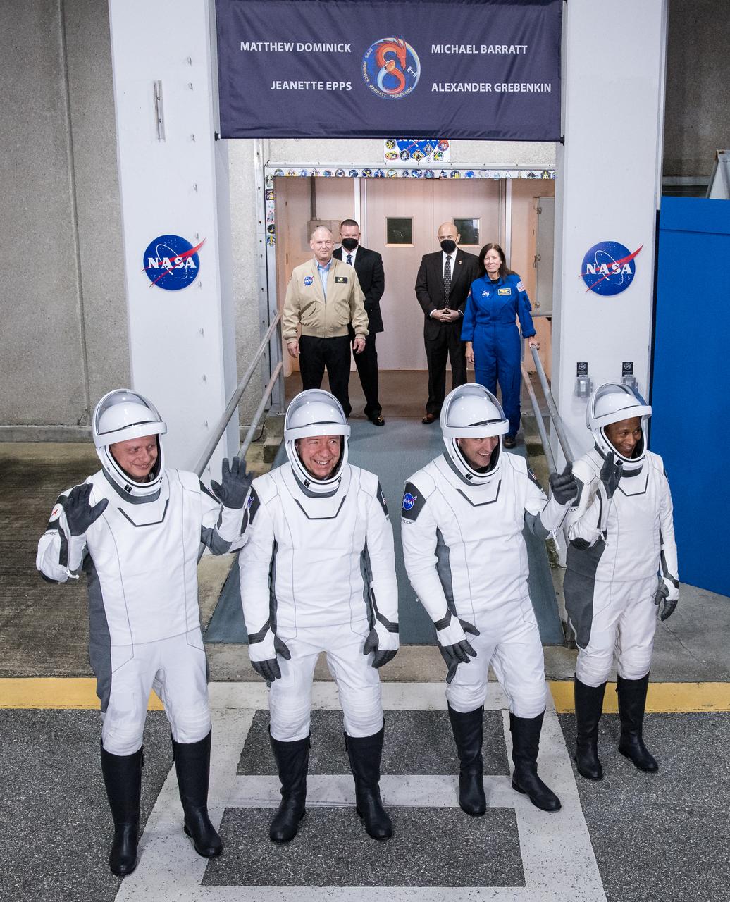 Roscosmos cosmonaut Alexander Grebenkin, left, NASA astronauts Michael Barratt, second from left, Matthew Dominick, second from right, and Jeanette Epps, right, wearing SpaceX spacesuits, are seen as they prepare to depart the Neil A. Armstrong Operations and Checkout Building for Launch Complex 39A to board the SpaceX Dragon spacecraft for the Crew-8 mission launch, Sunday, March 3, 2024, at NASA’s Kennedy Space Center in Florida. NASA’s SpaceX Crew-8 mission is the eighth crew rotation mission of the SpaceX Crew Dragon spacecraft and Falcon 9 rocket to the International Space Station as part of the agency’s Commercial Crew Program. Dominick, Barratt, Epps, Grebenkin are scheduled to launch at 10:53 p.m. EST on Sunday, March 3, from Launch Complex 39A at the Kennedy Space Center. Photo Credit: (NASA/Aubrey Gemignani)