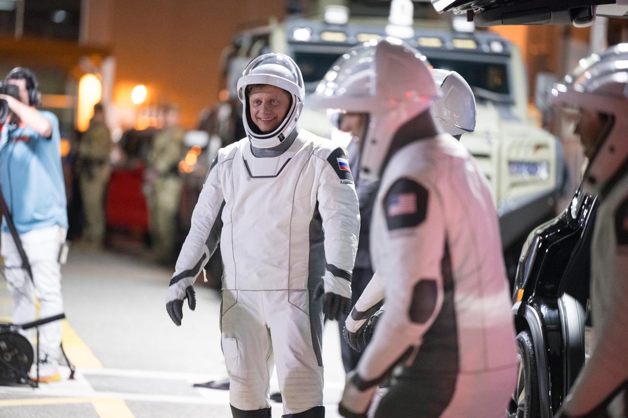 Roscosmos cosmonaut Alexander Grebenkin, NASA astronauts Jeanette Epps, Matthew Dominick, and Michael Barratt speak with family and friends as they prepare to depart the Neil  A. Armstrong Operations and Checkout Building for Launch Complex 39A to board the SpaceX Dragon spacecraft for the Crew-8 mission launch, Sunday, March 3, 2024, at NASA’s Kennedy Space Center in Florida. NASA’s SpaceX Crew-8 mission is the eighth crew rotation mission of the SpaceX Crew Dragon spacecraft and Falcon 9 rocket to the International Space Station as part of the agency’s Commercial Crew Program. Dominick, Barratt, Epps, Grebenkin are scheduled to launch at 10:53 p.m. EST on Sunday, March 3, from Launch Complex 39A at the Kennedy Space Center.  Photo Credit: (NASA/Aubrey Gemignani)
