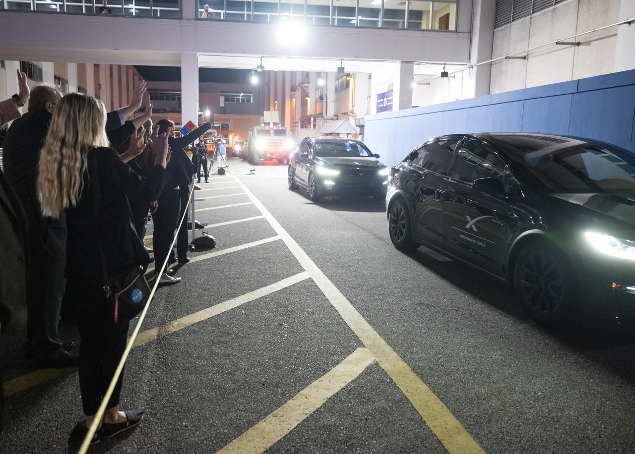 NASA Leadership and family and friends wave to NASA astronauts Matthew Dominick, Michael Barratt, and Jeanette Epps, and Roscosmos cosmonaut Alexander Grebenkin, as they depart the Neil A. Armstrong Operations and Checkout Building for Launch Complex 39A to board the SpaceX Dragon spacecraft for the Crew-8 mission launch, Sunday, March 3, 2024, at NASA’s Kennedy Space Center in Florida. NASA’s SpaceX Crew-8 mission is the eighth crew rotation mission of the SpaceX Crew Dragon spacecraft and Falcon 9 rocket to the International Space Station as part of the agency’s Commercial Crew Program. Dominick, Barratt, Epps, Grebenkin are scheduled to launch at 10:53 p.m. EST on Sunday, March 3, from Launch Complex 39A at the Kennedy Space Center. Photo Credit: (NASA/Aubrey Gemignani)