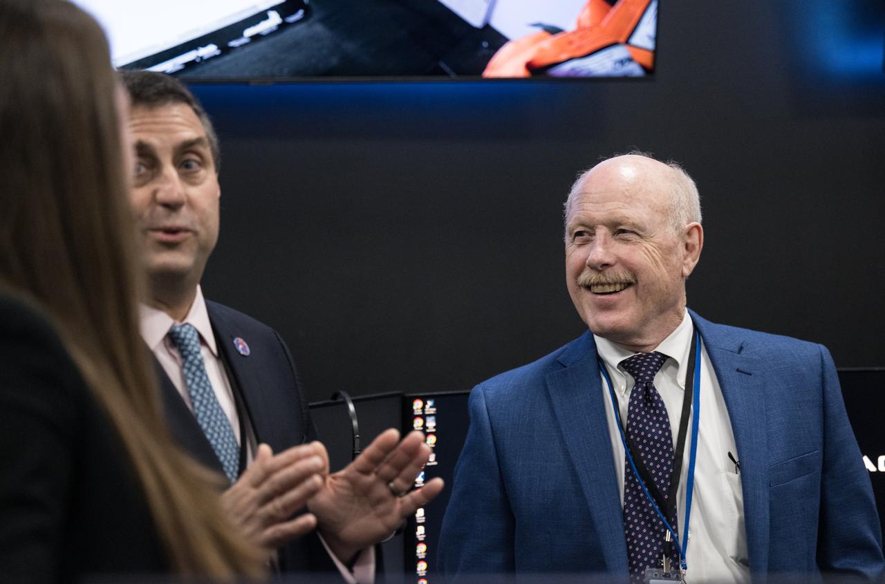 NASA International Space Station program manger Joel Montalbano, second from left, and Ken Bowersox, associate administrator for NASA's Space Operations Mission Directorate, right, speak with SpaceX Director, Dragon Mission Management, Sarah Walker after the launch of a SpaceX Falcon 9 rocket carrying the company's Dragon spacecraft on the Crew-8 mission with NASA astronauts Matthew Dominick, Michael Barratt, and Jeanette Epps, and Roscosmos cosmonaut Alexander Grebenkin onboard, Sunday, March 3, 2024, in the control room of SpaceX’s HangarX at NASA’s Kennedy Space Center in Florida. NASA’s SpaceX Crew-8 mission is the eighth crew rotation mission of the SpaceX Dragon spacecraft and Falcon 9 rocket to the International Space Station as part of the agency’s Commercial Crew Program. Dominick, Barratt, Epps, and Grebenkin launched at 10:53 p.m. EST, from Launch Complex 39A at the Kennedy Space Center. Photo Credit: (NASA/Aubrey Gemignani)