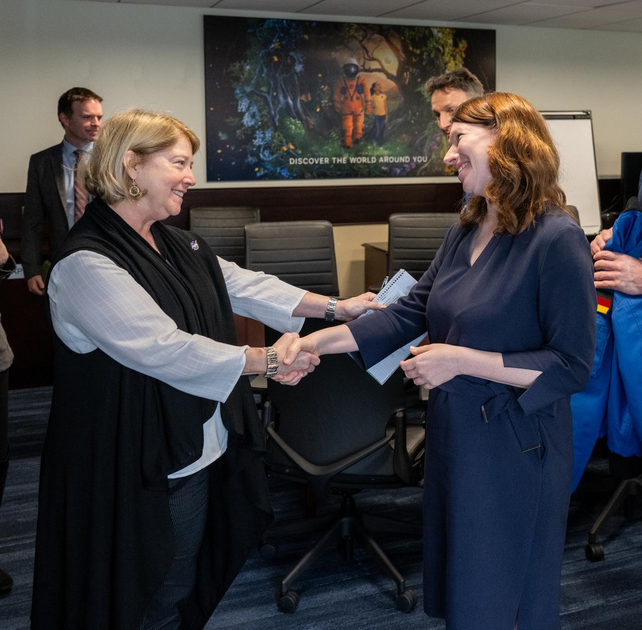 NASA Deputy Administrator Pam Melroy, left, shakes hands with Federal Government Coordinator of German Aerospace Policy Dr. Anna Christmann, right, Thursday, March 7, 2024, at the Mary W. Jackson NASA Headquarters building in Washington. Photo Credit: (NASA/Keegan Barber)