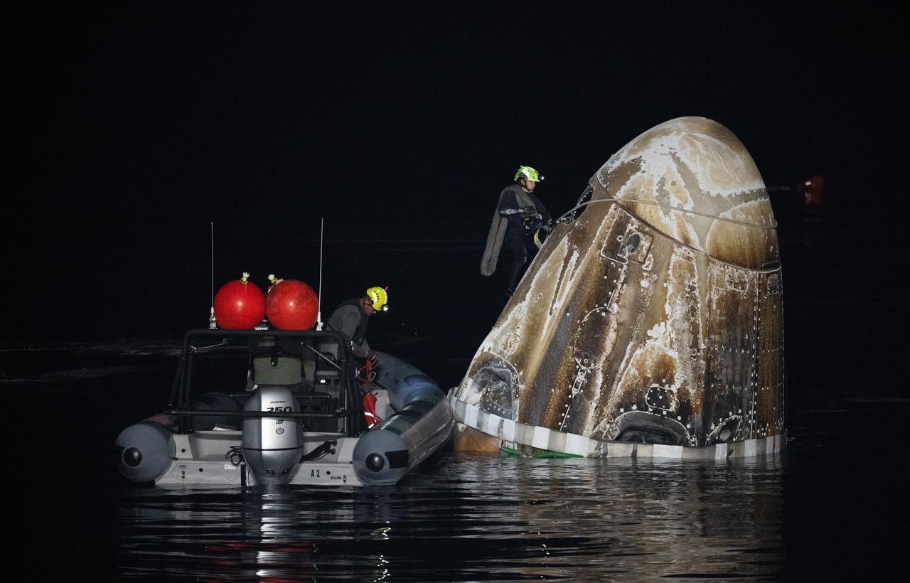Support teams work around the SpaceX Dragon Endurance spacecraft shortly after it landed with NASA astronaut Jasmin Moghbeli, ESA (European Space Agency) astronaut Andreas Mogensen, Japan Aerospace Exploration Agency (JAXA) astronaut Satoshi Furukawa, and Roscosmos cosmonaut Konstantin Borisov aboard in the Gulf of Mexico off the coast of Pensacola, Florida, Tuesday, March 12,2024. Moghbeli, Mogensen, Furukawa, and Borisov are returning after nearly six-months in space as part of Expedition 70 aboard the International Space Station. Photo Credit: (NASA/Joel Kowsky)