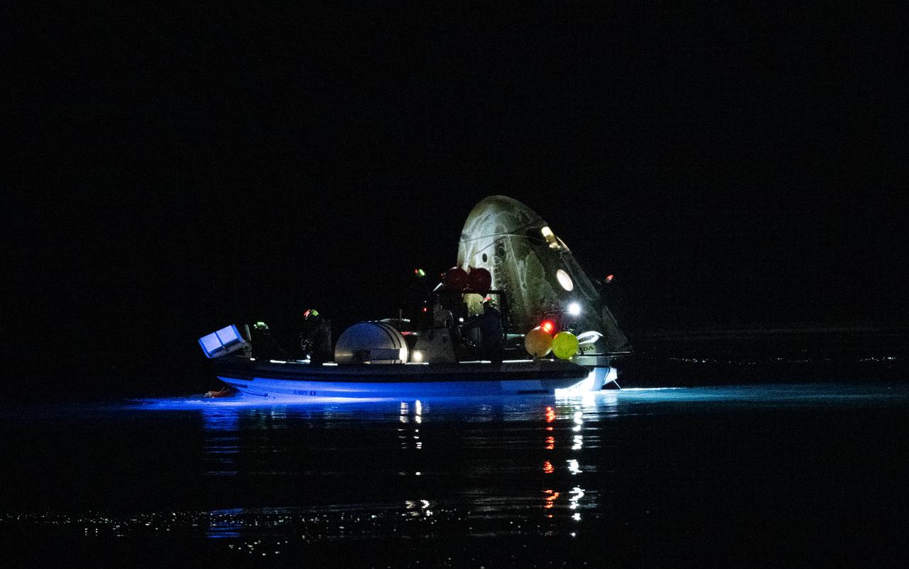 Support teams work around the SpaceX Dragon Endurance spacecraft shortly after it landed with NASA astronaut Jasmin Moghbeli, ESA (European Space Agency) astronaut Andreas Mogensen, Japan Aerospace Exploration Agency (JAXA) astronaut Satoshi Furukawa, and Roscosmos cosmonaut Konstantin Borisov aboard in the Gulf of Mexico off the coast of Pensacola, Florida, Tuesday, March 12,2024. Moghbeli, Mogensen, Furukawa, and Borisov are returning after nearly six-months in space as part of Expedition 70 aboard the International Space Station. Photo Credit: (NASA/Joel Kowsky)