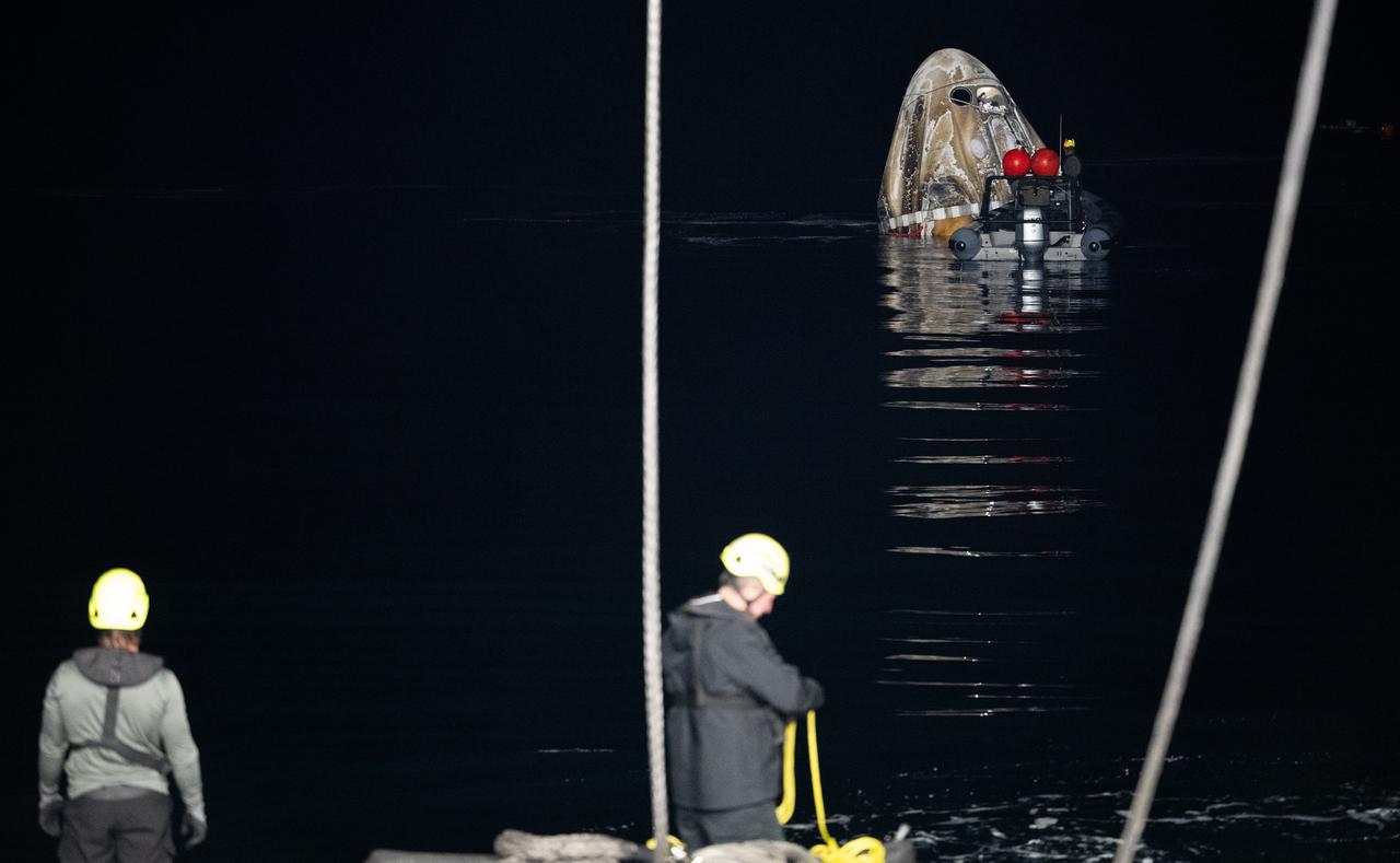 Support teams work around the SpaceX Dragon Endurance spacecraft shortly after it landed with NASA astronaut Jasmin Moghbeli, ESA (European Space Agency) astronaut Andreas Mogensen, Japan Aerospace Exploration Agency (JAXA) astronaut Satoshi Furukawa, and Roscosmos cosmonaut Konstantin Borisov aboard in the Gulf of Mexico off the coast of Pensacola, Florida, Tuesday, March 12,2024. Moghbeli, Mogensen, Furukawa, and Borisov are returning after nearly six-months in space as part of Expedition 70 aboard the International Space Station. Photo Credit: (NASA/Joel Kowsky)