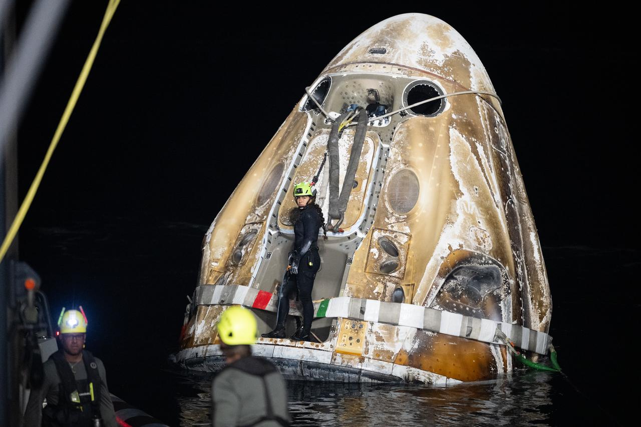 Support teams work around the SpaceX Dragon Endurance spacecraft shortly after it landed with NASA astronaut Jasmin Moghbeli, ESA (European Space Agency) astronaut Andreas Mogensen, Japan Aerospace Exploration Agency (JAXA) astronaut Satoshi Furukawa, and Roscosmos cosmonaut Konstantin Borisov aboard in the Gulf of Mexico off the coast of Pensacola, Florida, Tuesday, March 12,2024. Moghbeli, Mogensen, Furukawa, and Borisov are returning after nearly six-months in space as part of Expedition 70 aboard the International Space Station. Photo Credit: (NASA/Joel Kowsky)