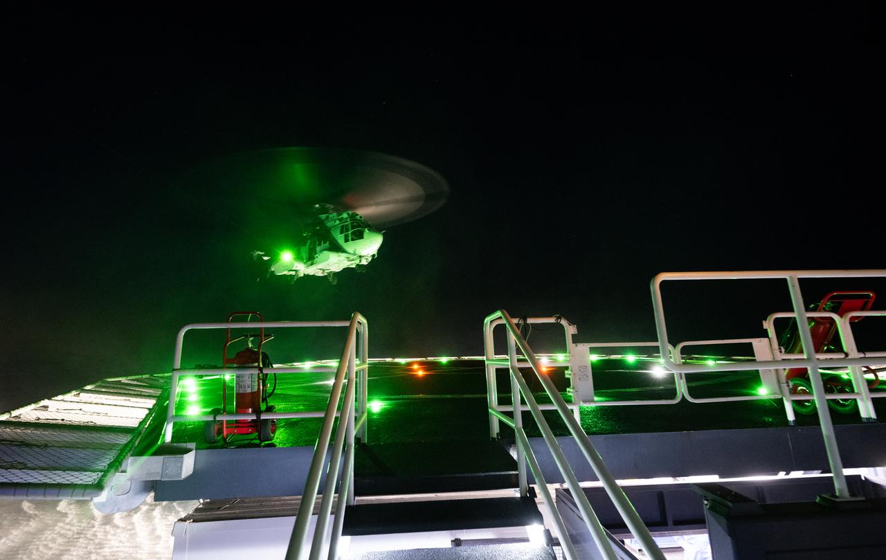 The helicopter that will carry NASA astronaut Jasmin Moghbeli, ESA (European Space Agency) astronaut Andreas Mogensen, Japan Aerospace Exploration Agency (JAXA) astronaut Satoshi Furukawa, and Roscosmos cosmonaut Konstantin Borisov is seen as it lands on the SpaceX recovery ship MEGAN in the Gulf of Mexico off the coast of Pensacola, Florida, Tuesday, March 12, 2024. Moghbeli, Mogensen, Furukawa, and Borisov are returning after nearly six-months in space as part of Expedition 70 aboard the International Space Station. Photo Credit: (NASA/Joel Kowsky)
