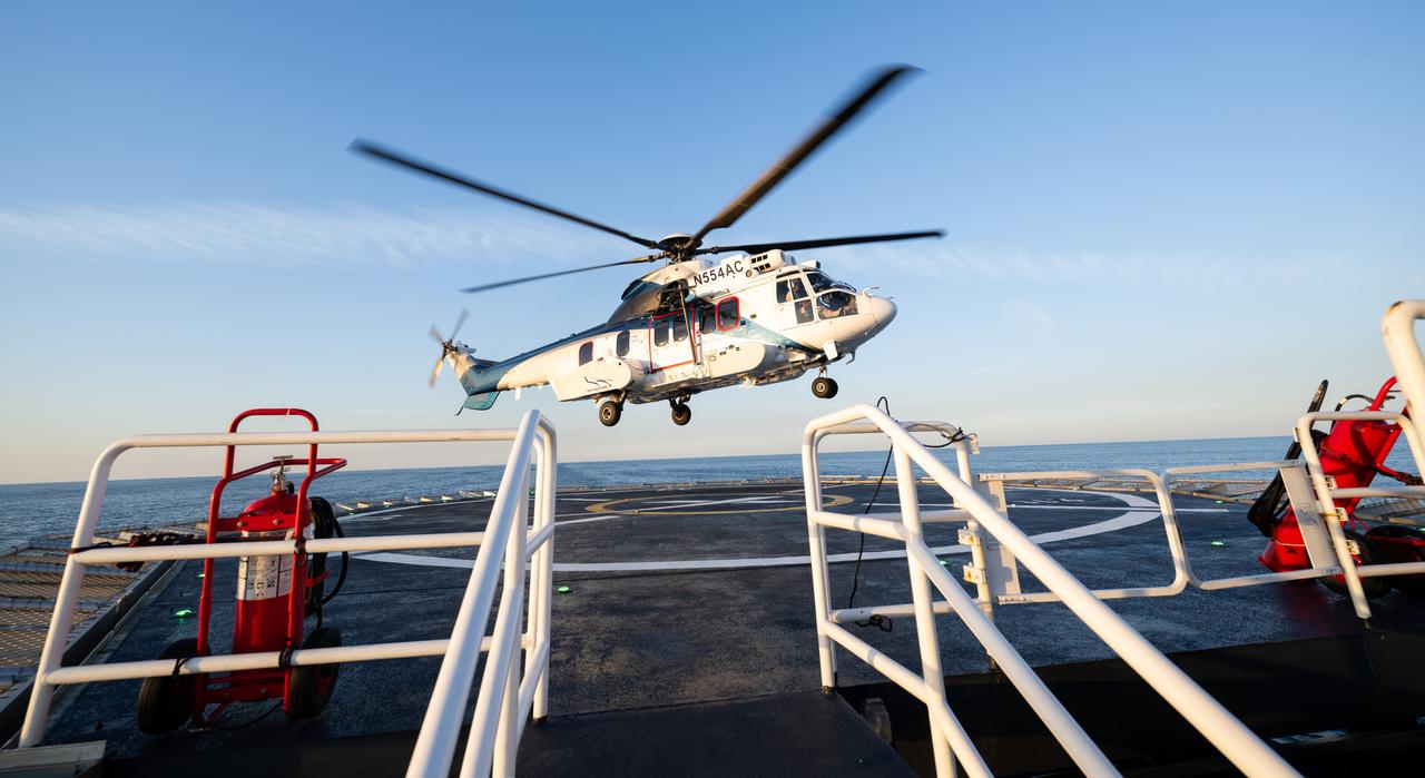 The helicopter carrying NASA astronaut Jasmin Moghbeli, ESA (European Space Agency) astronaut Andreas Mogensen, Japan Aerospace Exploration Agency (JAXA) astronaut Satoshi Furukawa, and Roscosmos cosmonaut Konstantin Borisov is seen takes off from the SpaceX recovery ship MEGAN in the Gulf of Mexico off the coast of Pensacola, Florida, Tuesday, March 12, 2024. Moghbeli, Mogensen, Furukawa, and Borisov are returning after nearly six-months in space as part of Expedition 70 aboard the International Space Station. Photo Credit: (NASA/Joel Kowsky)