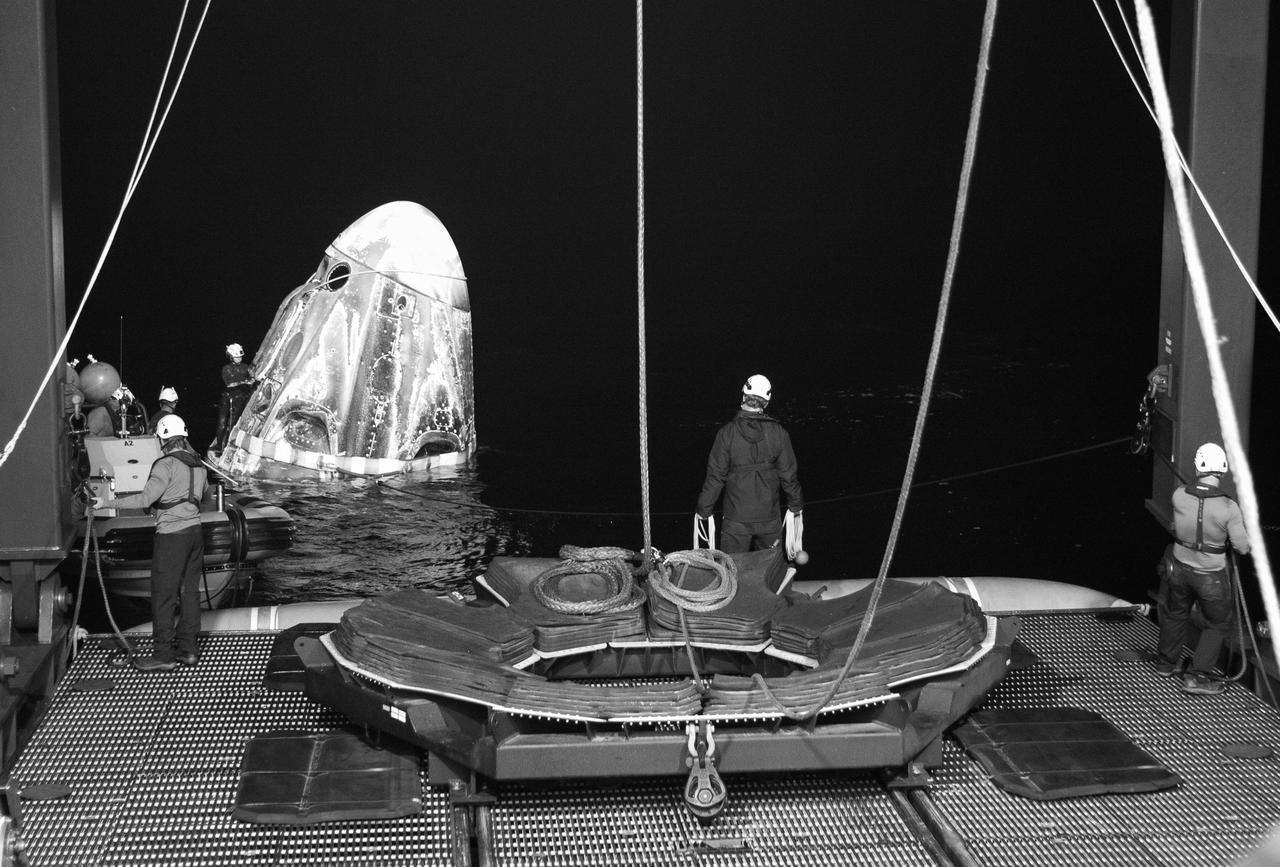 Support teams work around the SpaceX Dragon Endurance spacecraft shortly after it landed with NASA astronaut Jasmin Moghbeli, ESA (European Space Agency) astronaut Andreas Mogensen, Japan Aerospace Exploration Agency (JAXA) astronaut Satoshi Furukawa, and Roscosmos cosmonaut Konstantin Borisov aboard in the Gulf of Mexico off the coast of Pensacola, Florida, Tuesday, March 12,2024. Moghbeli, Mogensen, Furukawa, and Borisov are returning after nearly six-months in space as part of Expedition 70 aboard the International Space Station. Photo Credit: (NASA/Joel Kowsky)