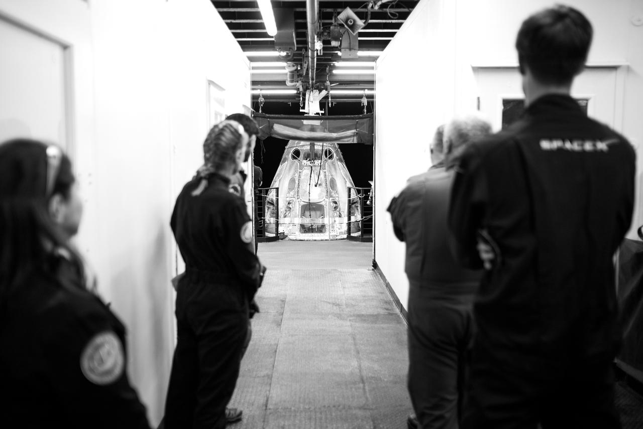 Medical teams watch as the SpaceX Dragon Endurance spacecraft is moved onboard the SpaceX recovery ship MEGAN shortly after it landed with NASA astronaut Jasmin Moghbeli, ESA (European Space Agency) astronaut Andreas Mogensen, Japan Aerospace Exploration Agency (JAXA) astronaut Satoshi Furukawa, and Roscosmos cosmonaut Konstantin Borisov aboard in the Gulf of Mexico off the coast of Pensacola, Florida, Tuesday, March 12, 2024. Moghbeli, Mogensen, Furukawa, and Borisov are returning after nearly six-months in space as part of Expedition 70 aboard the International Space Station. Photo Credit: (NASA/Joel Kowsky)
