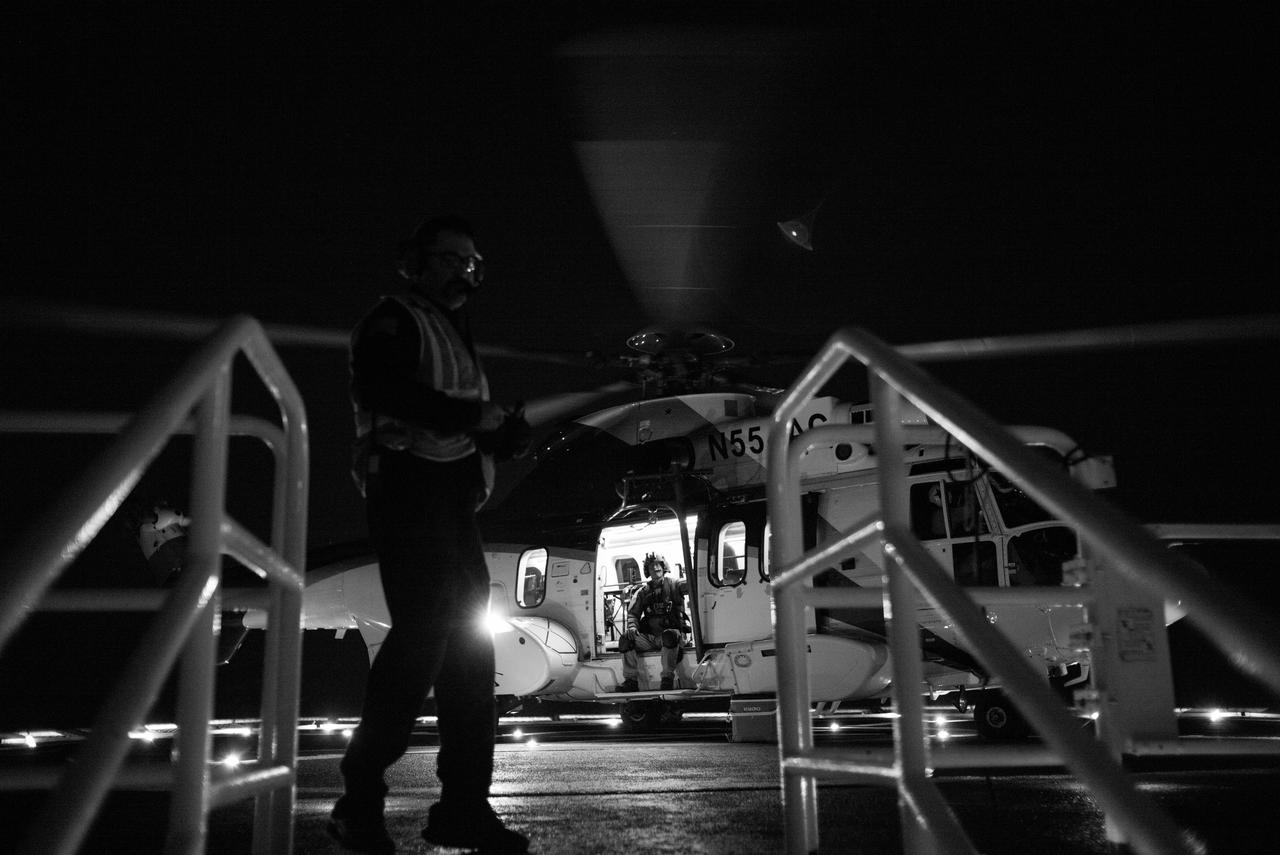 The helicopter that will carry NASA astronaut Jasmin Moghbeli, ESA (European Space Agency) astronaut Andreas Mogensen, Japan Aerospace Exploration Agency (JAXA) astronaut Satoshi Furukawa, and Roscosmos cosmonaut Konstantin Borisov is on the helideck of SpaceX recovery ship MEGAN in the Gulf of Mexico off the coast of Pensacola, Florida as the crew prepares to be flown back to shore, Tuesday, March 12, 2024. Moghbeli, Mogensen, Furukawa, and Borisov are returning after nearly six-months in space as part of Expedition 70 aboard the International Space Station. Photo Credit: (NASA/Joel Kowsky)