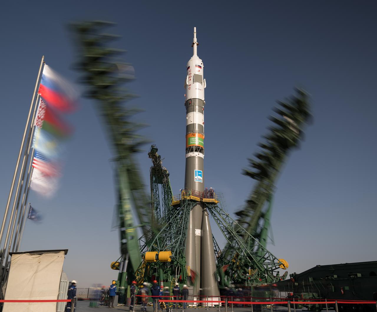 In this 30-second exposure photograph, the gantry arms are seen closing around the Soyuz rocket at launch pad at Site 31, Monday, March 18, 2024, at the Baikonur Cosmodrome in Kazakhstan. Expedition 71 NASA astronaut Tracy Dyson, Roscosmos cosmonaut Oleg Novitskiy, and Belarus spaceflight participant Marina Vasilevskaya are scheduled to launch aboard their Soyuz MS-25 spacecraft on March 21. Photo Credit: (NASA/Bill Ingalls)