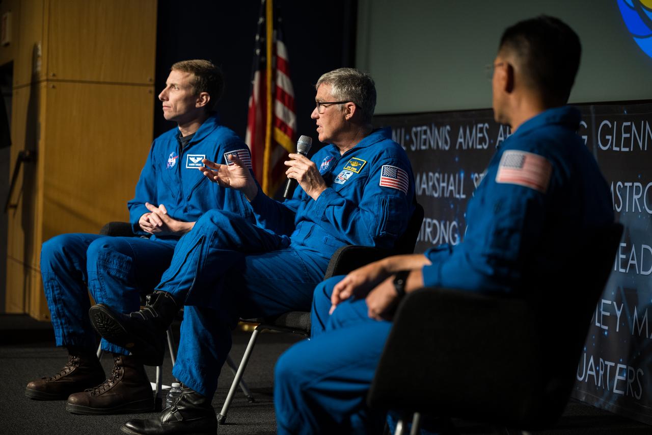 NASA astronauts Stephen Bowen, center, Warren Hoburg, left, and Frank Rubio, right, and UAE (United Arab Emirates) astronaut Sultan Alneyadi, not pictured, speak about their time onboard the International Space Station as part of Expedition 69 during an employee engagement event Tuesday, March 19, 2024, at the Mary W. Jackson NASA Headquarters building in Washington. Bowen, Hoburg, and Alneyadi spent 186 days aboard the International Space Station as part of Expedition 69; while Rubio set a new record for the longest single spaceflight by a U.S. astronaut, spending 371 days in orbit on an extended mission spanning Expeditions 68 and 69. Photo Credit: (NASA/Aubrey Gemignani)