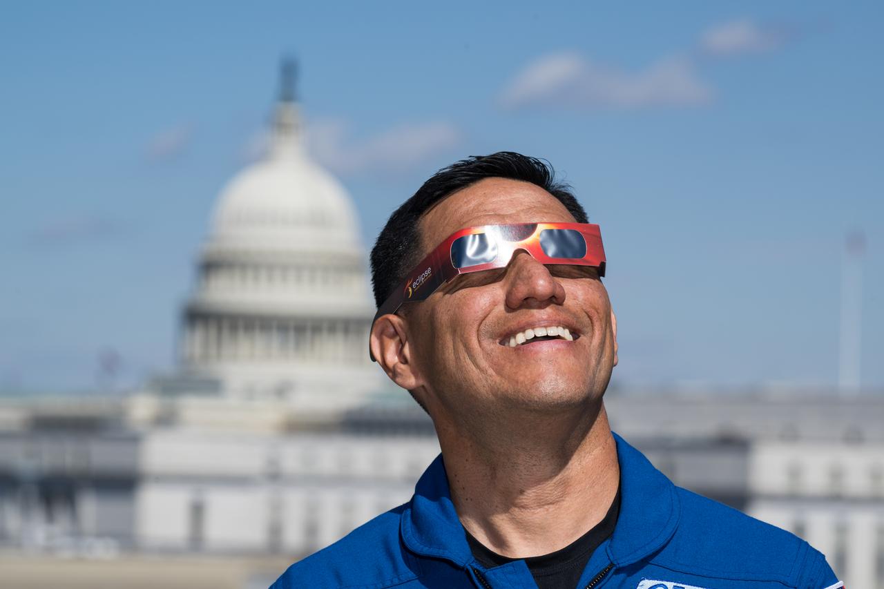 NASA astronaut Frank Rubio poses for a photo wearing solar glasses, Tuesday, March 19, 2024, at the Mary W. Jackson NASA Headquarters building in Washington. Expedition 69 crewmates NASA astronauts Stephen Bowen and Warren Hoburg, and UAE (United Arab Emirates) astronaut Sultan Alneyadi spent 186 days aboard the International Space Station as part of Expedition 69; while Rubio set a new record for the longest single spaceflight by a U.S. astronaut, spending 371 days in orbit on an extended mission spanning Expeditions 68 and 69. Photo Credit: (NASA/Aubrey Gemignani)