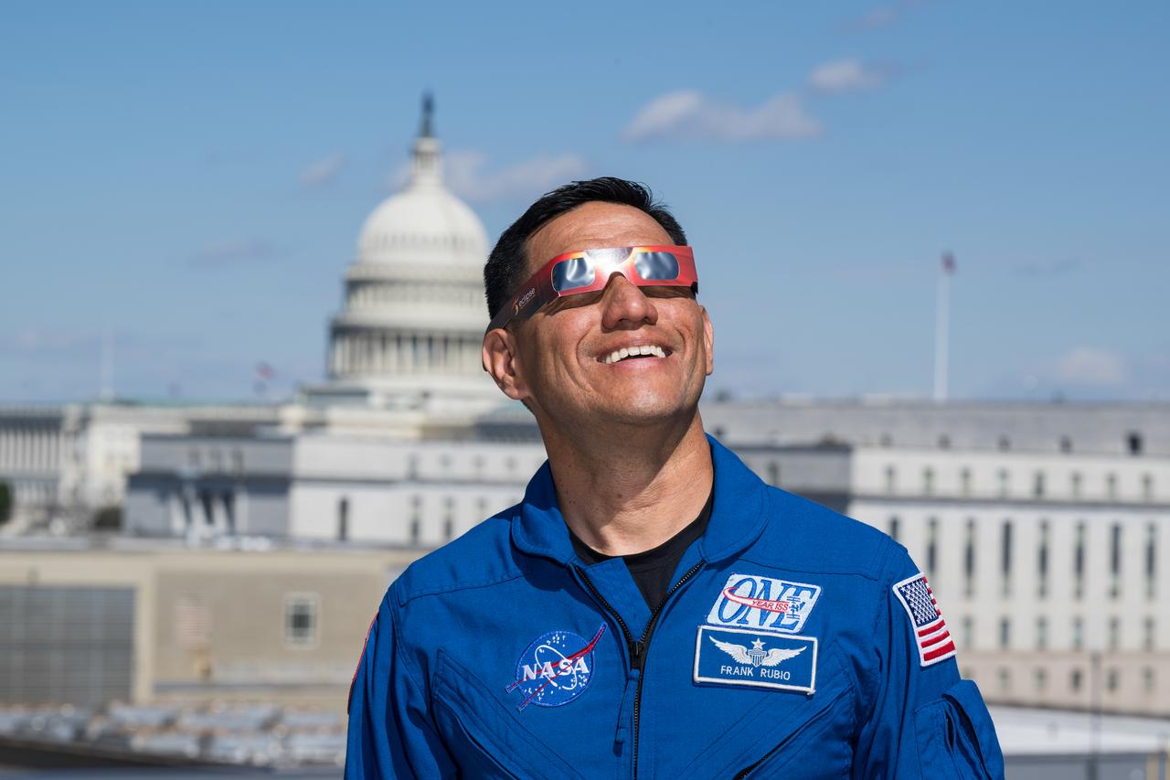 NASA astronaut Frank Rubio poses for a photo wearing solar glasses, Tuesday, March 19, 2024, at the Mary W. Jackson NASA Headquarters building in Washington. Expedition 69 crewmates NASA astronauts Stephen Bowen and Warren Hoburg, and UAE (United Arab Emirates) astronaut Sultan Alneyadi spent 186 days aboard the International Space Station as part of Expedition 69; while Rubio set a new record for the longest single spaceflight by a U.S. astronaut, spending 371 days in orbit on an extended mission spanning Expeditions 68 and 69. Photo Credit: (NASA/Aubrey Gemignani)