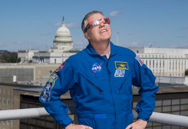NASA image: Expedition 69 Crew Wears Solar Eclipse Glasses
