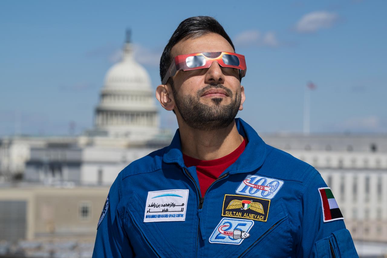UAE (United Arab Emirates) astronaut Sultan Alneyadi poses for a photo wearing solar glasses, Tuesday, March 19, 2024, at the Mary W. Jackson NASA Headquarters building in Washington. Alneyadi and Expedition 69 crewmates NASA astronauts Stephen Bowen and Warren Hoburg spent 186 days aboard the International Space Station as part of Expedition 69; while NASA astronaut Frank Rubio set a new record for the longest single spaceflight by a U.S. astronaut, spending 371 days in orbit on an extended mission spanning Expeditions 68 and 69. Photo Credit: (NASA/Aubrey Gemignani)