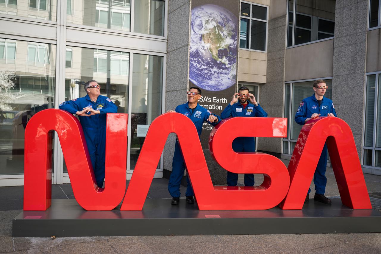 NASA astronauts Stephen Bowen, left,  and Frank Rubio, UAE (United Arab Emirates) astronaut Sultan Alneyadi, and NASA astronaut Warren Hoburg, right, pose for a photo wearing solar glasses, Tuesday, March 19, 2024, at the Mary W. Jackson NASA Headquarters building in Washington. Bowen, Hoburg, and Alneyadi spent 186 days aboard the International Space Station as part of Expedition 69; while Rubio set a new record for the longest single spaceflight by a U.S. astronaut, spending 371 days in orbit on an extended mission spanning Expeditions 68 and 69. Photo Credit: (NASA/Aubrey Gemignani)