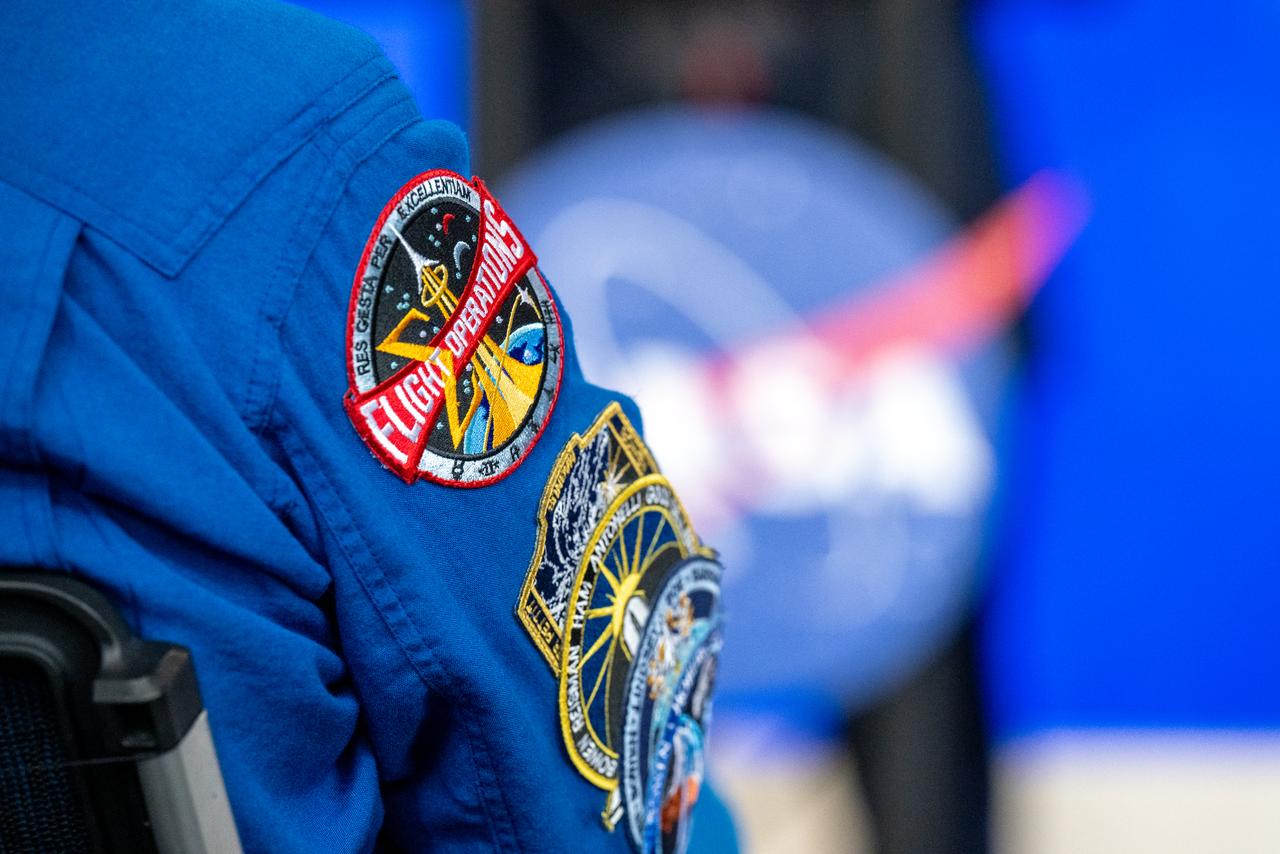 Mission patches are seen on NASA astronaut Stephen Bowen's flight suit during an event with NASA and the Department of Health and Human (HHS) to highlight how the agencies are making progress toward President Joe Biden and First Lady Jill Biden’s Cancer Moonshot initiative, Thursday, March 21, 2024, in the Earth Information Center at the Mary W. Jackson NASA Headquarters building in Washington. NASA is working with agencies and researchers across the federal government to help cut the nation’s cancer death rate by at least 50% in the next 25 years, a goal of the Cancer Moonshot Initiative. Photo Credit: (NASA/Keegan Barber)