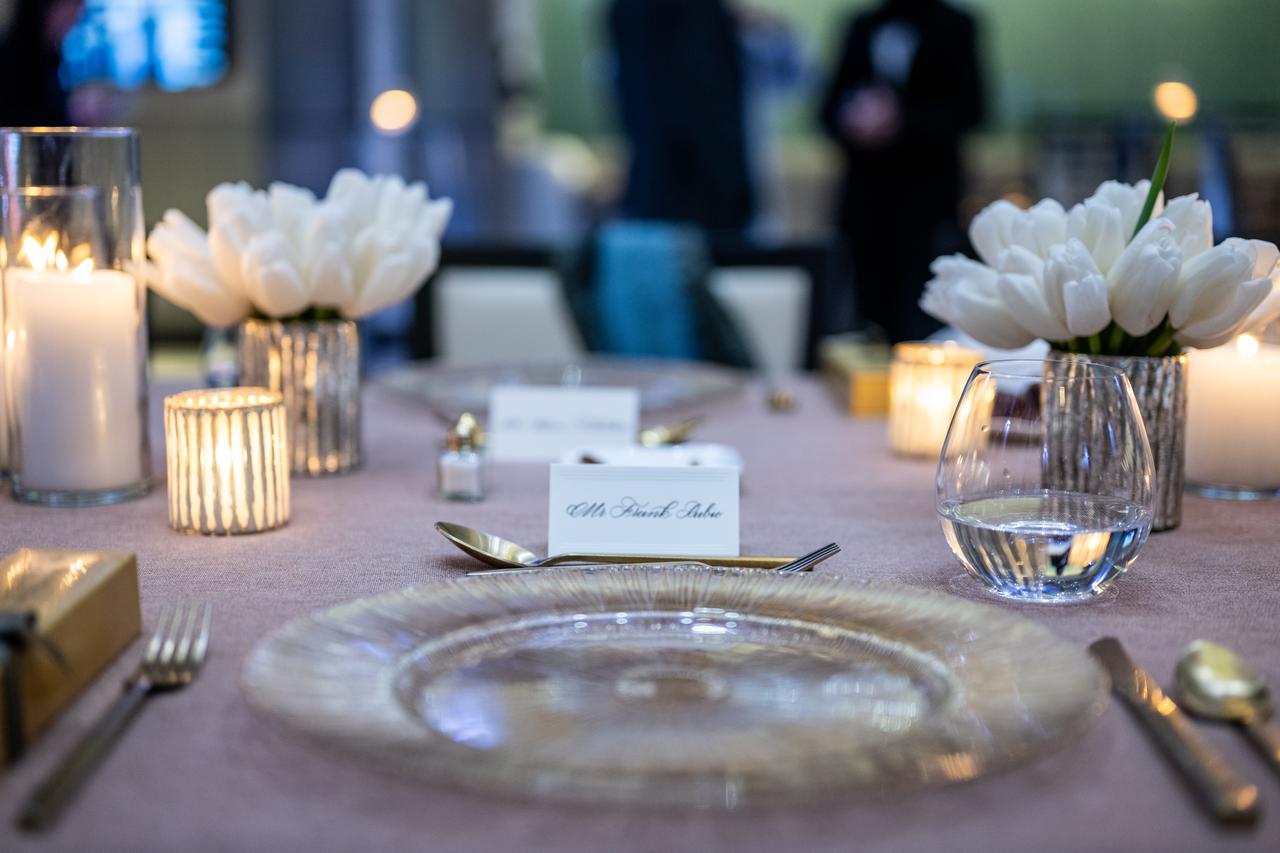 A table setting for NASA astronaut Frank Rubio is seen during an Iftar dinner hosted by UAE (United Arab Emirates) astronaut Sultan Alneyadi, Thursday, March 21, 2024, at the UAE Embassy in Washington. Alneyadi spent 186 days aboard the International Space Station as part of Expedition 69; while Rubio set a new record for the longest single spaceflight by a U.S. astronaut, spending 371 days in orbit on an extended mission spanning Expeditions 68 and 69. Photo Credit: (NASA/Keegan Barber)