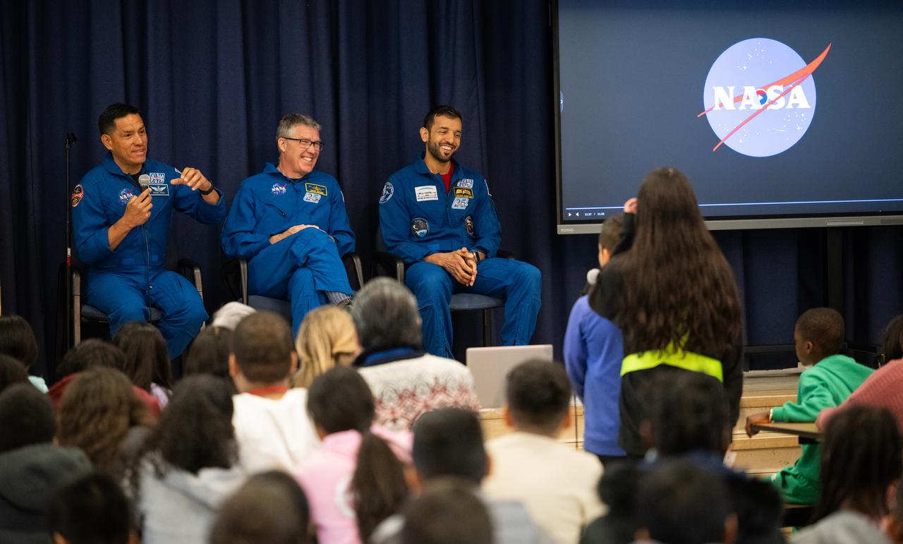 NASA astronauts Frank Rubio, left, and Stephen Bowen and UAE (United Arab Emirates) astronaut Sultan Alneyadi answer questions from students at Rolling Terrace Elementary School, Friday, March 22, 2024, in Takoma Park, Maryland. Bowen and Alneyadi spent 186 days aboard the International Space Station as part of Expedition 69; while Rubio set a new record for the longest single spaceflight by a U.S. astronaut, spending 371 days in orbit on an extended mission spanning Expeditions 68 and 69. Photo Credit: (NASA/Joel Kowsky)