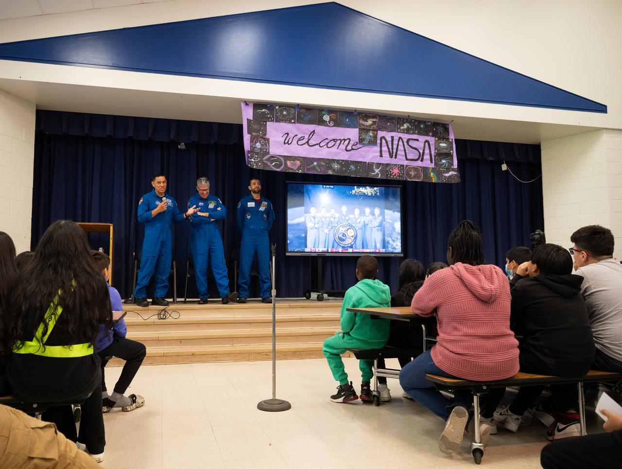 NASA astronauts Frank Rubio, left, and Stephen Bowen and UAE (United Arab Emirates) astronaut Sultan Alneyadi speak to students at Rolling Terrace Elementary School, Friday, March 22, 2024, in Takoma Park, Maryland. Bowen and Alneyadi spent 186 days aboard the International Space Station as part of Expedition 69; while Rubio set a new record for the longest single spaceflight by a U.S. astronaut, spending 371 days in orbit on an extended mission spanning Expeditions 68 and 69. Photo Credit: (NASA/Joel Kowsky)