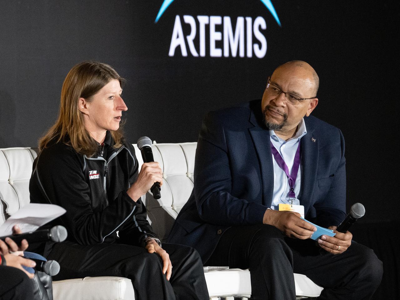 Andrea Mueller, engineer at Team Penske, left, speaks to students about careers in STEM during a panel discussion at the Shell Eco-marathon Americas alongside Torry Johnson, deputy associate administrator for STEM Engagement in NASA's Office of STEM Engagement, Thursday, April 4, 2024, at the Indianapolis Motor Speedway in Indianapolis, Ind. Photo Credit: (NASA/Joel Kowsky)
