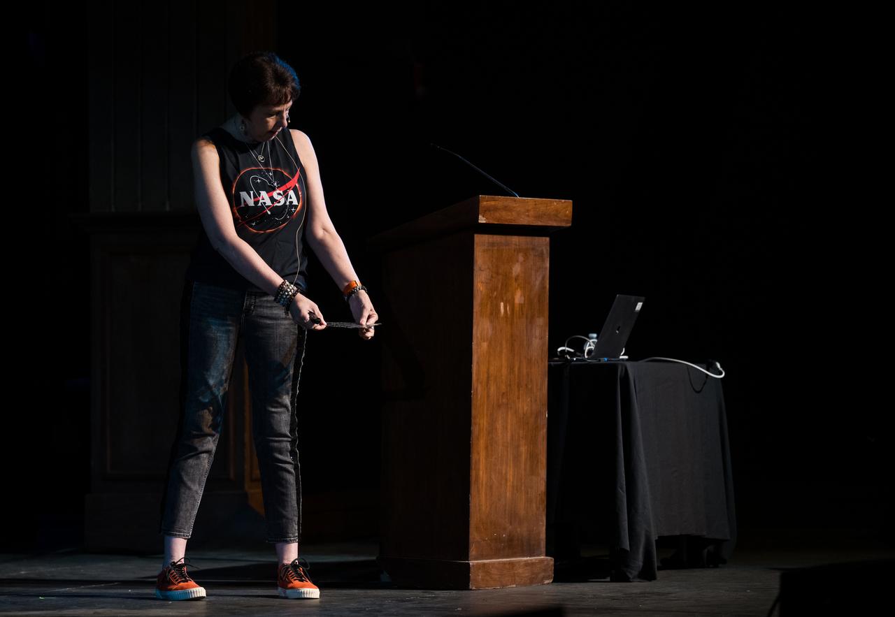 NASA Associate Administrator for the Science Mission Directorate, Dr. Nicky Fox, demonstrates how to use a pinhole projector during a presentation about the upcoming total solar eclipse, Saturday, April 6, 2024 at the Cailloux Theater in Kerrville, Texas. On Monday, April 8, a total solar eclipse will sweep across a narrow portion of the North American continent from Mexico’s Pacific coast to the Atlantic coast of Newfoundland, Canada, while a partial solar eclipse will be visible across the entire North American continent along with parts of Central America and Europe. Photo Credit: (NASA/Aubrey Gemignani)