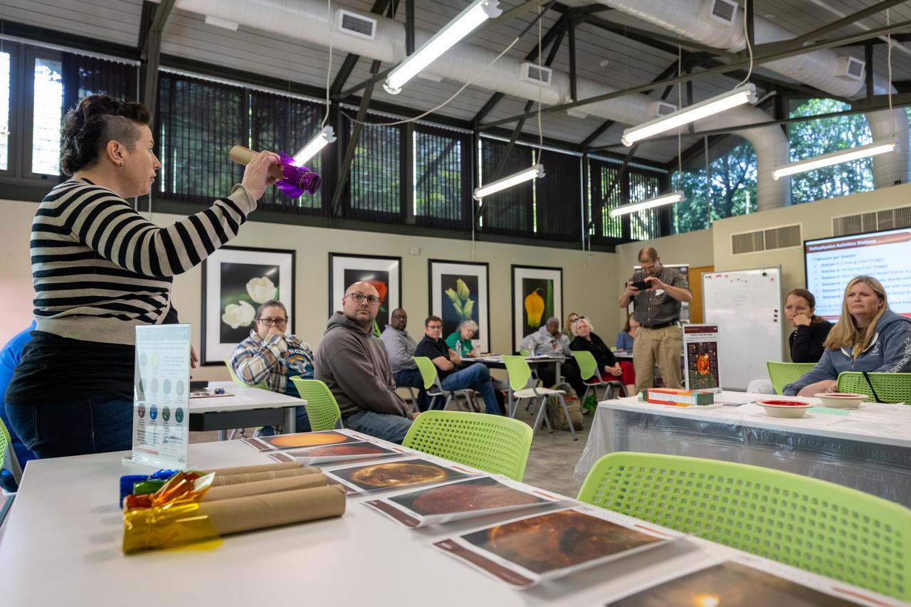 NASA Education Specialist Christine Milotte demonstrates heliophysics activities during a teacher professional development event hosted by the NASA Heliophysics Education Activation Team (HEAT) at the Dallas Arboretum, Saturday, April 6, 2024, in Dallas, Texas. Photo Credit: (NASA/Keegan Barber)