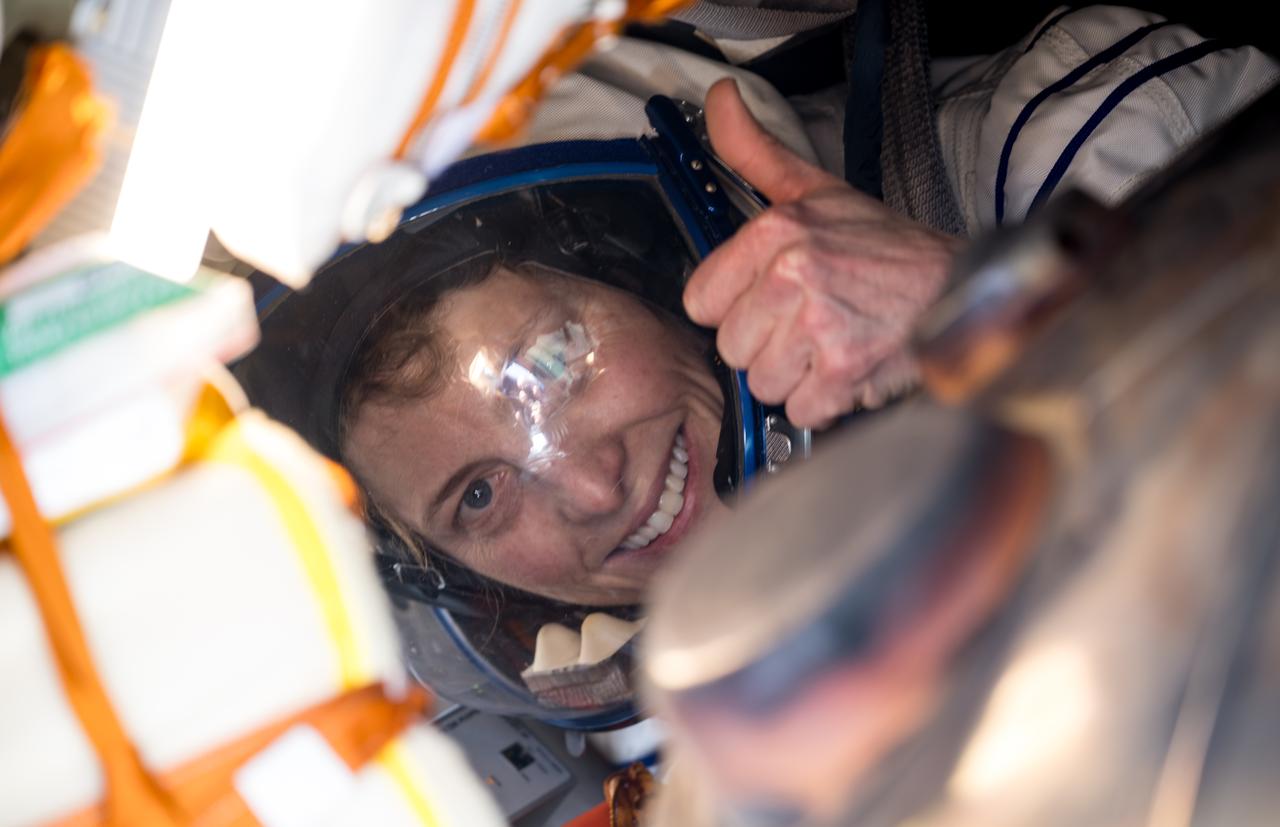 Expedition 70 NASA astronaut Loral O'Hara gives a thumbs up inside the Soyuz MS-24 spacecraft after she, Roscosmos cosmonaut Oleg Novitskiy, and Belarus spaceflight participant Marina Vasilevskaya, landed in a remote area near the town of Zhezkazgan, Kazakhstan, Saturday, April 6, 2024. O’Hara is returning to Earth after logging 204 days in space as a member of Expeditions 69-70 aboard the International Space Station and Novitskiy and Vasilevskaya return after having spent the last 14 days in space. Photo Credit (NASA/Bill Ingalls)