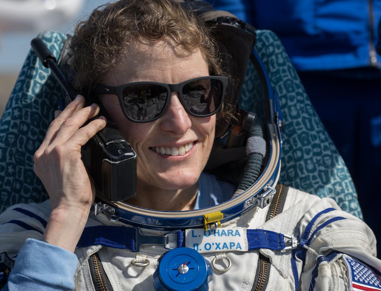 Expedition 70 NASA astronaut Loral O'Hara is seen talking on a satellite phone outside the Soyuz MS-24 spacecraft after she, Roscosmos cosmonaut Oleg Novitskiy, and Belarus spaceflight participant Marina Vasilevskaya landed in a remote area near the town of Zhezkazgan, Kazakhstan on Saturday, April 6, 2024. O’Hara is returning to Earth after logging 204 days in space as a member of Expeditions 69-70 aboard the International Space Station and Novitskiy and Vasilevskaya return after having spent the last 14 days in space. Photo Credit (NASA/Bill Ingalls)
