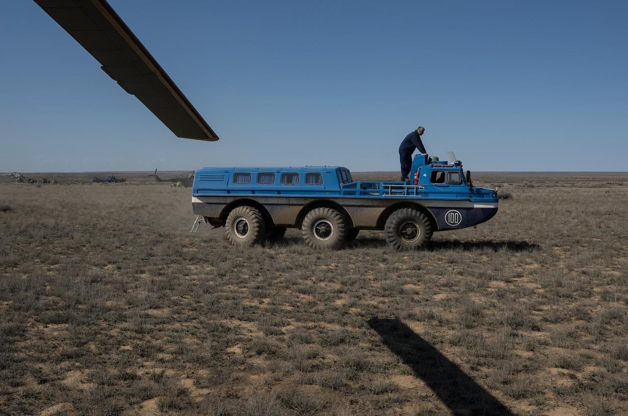 Expedition 70 NASA astronaut Loral O'Hara is brought to a waiting Russian MI-8 helicopter in an All Terrain Vehicle (ATV) after she, Roscosmos cosmonaut Oleg Novitskiy, and Belarus spaceflight participant Marina Vasilevskaya, landed in their Soyuz MS-24 spacecraft near the town of Zhezkazgan, Kazakhstan on Saturday, April 6, 2024. O’Hara is returning to Earth after logging 204 days in space as a member of Expeditions 69-70 aboard the International Space Station and Novitskiy and Vasilevskaya return after having spent the last 14 days in space. Photo Credit (NASA/Bill Ingalls)